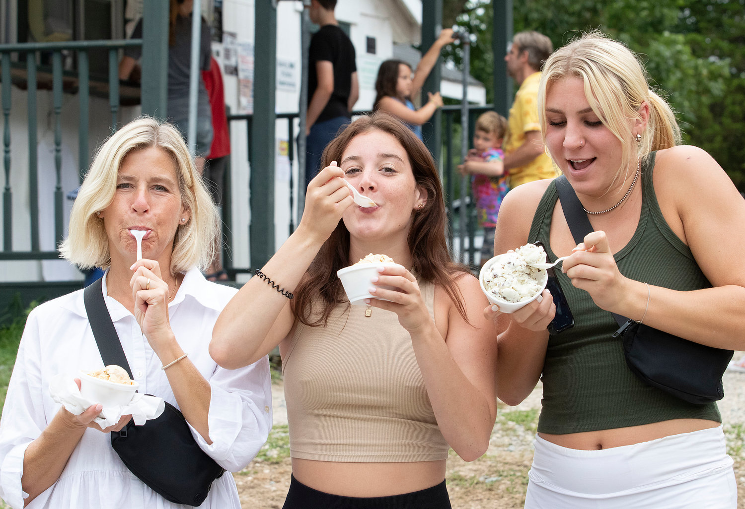 Mary Penn, Grace Holowka and Emily Penn (left to right) enjoy their ice cream at Wood’s Farm Ice Cream in Westport.
