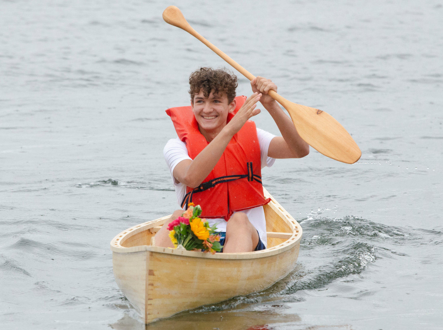 Student Erich Veegh tries out the boat.