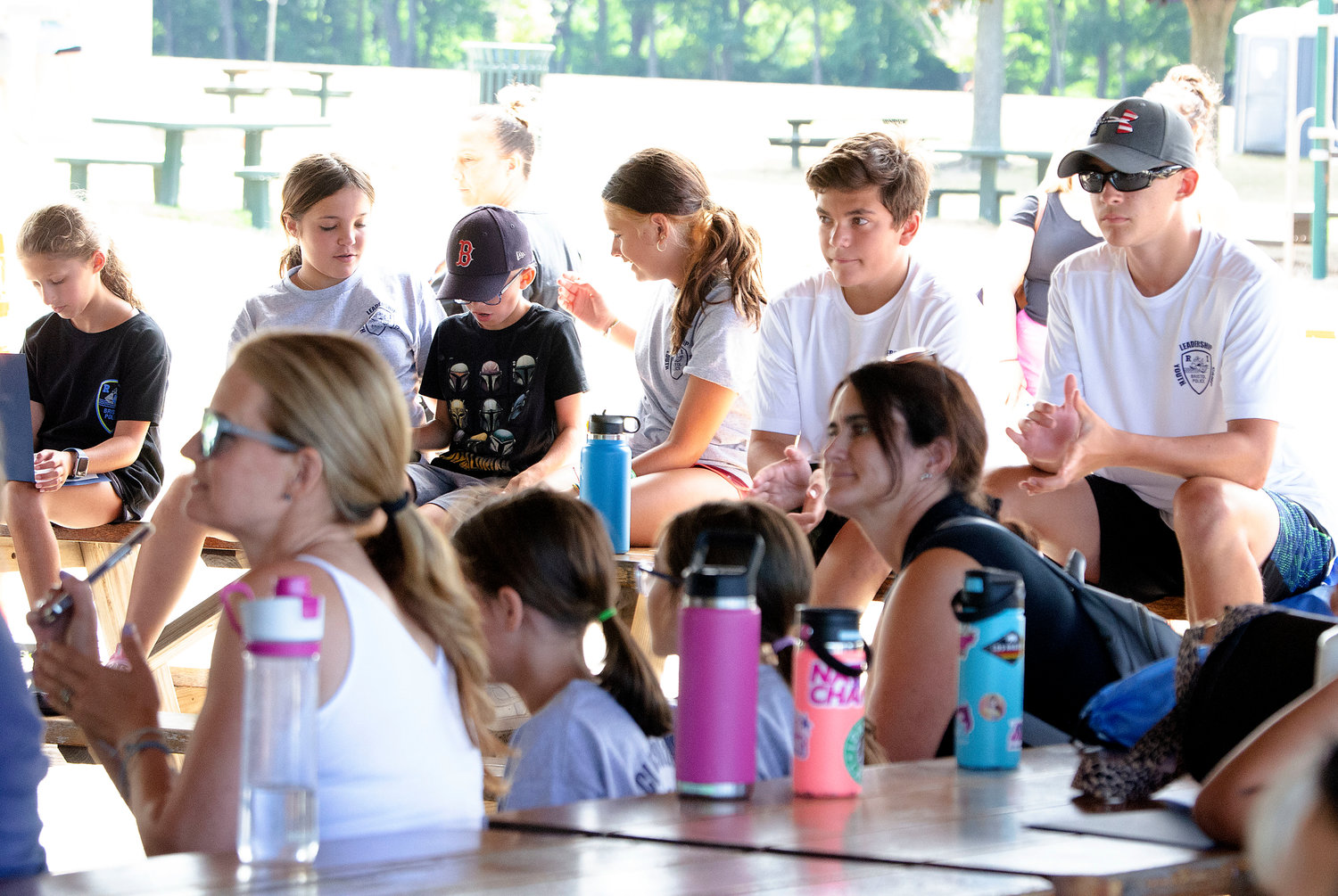 Leadership academy leaders Ella Pirri (left) Domenic Baldinelli and Robert Ennis and others cheer on a camper.