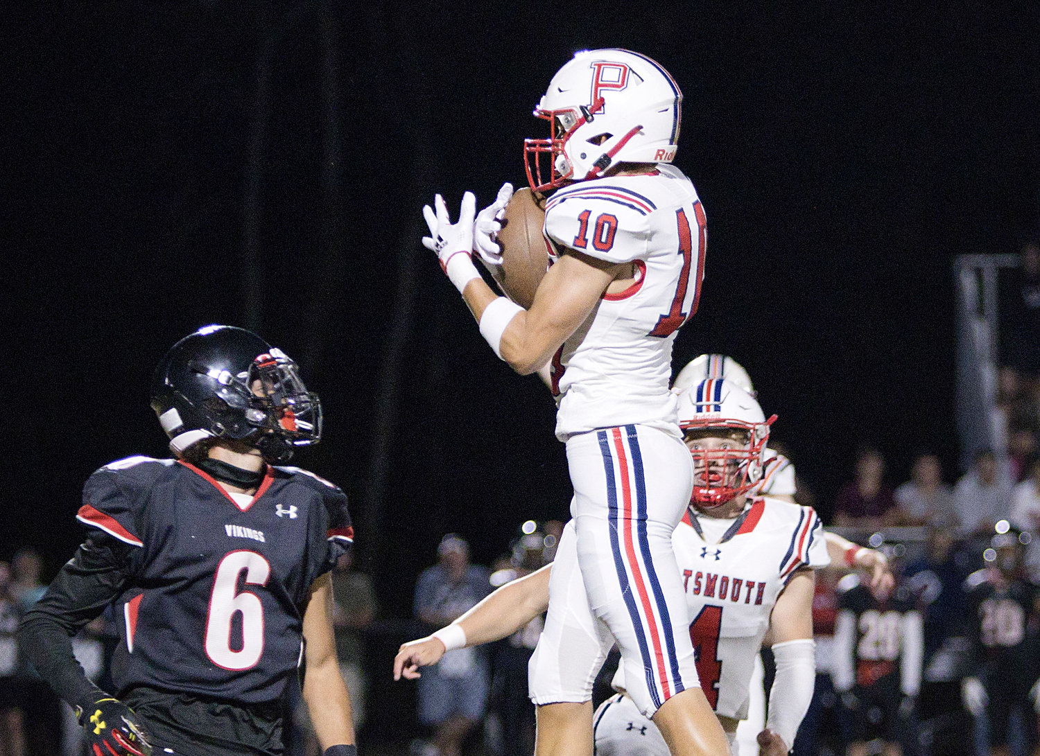 The Patriots’ Evan Tullson intercepts a pass during the Vikings’ first possession of the game, which led to a touchdown for Portsmouth.