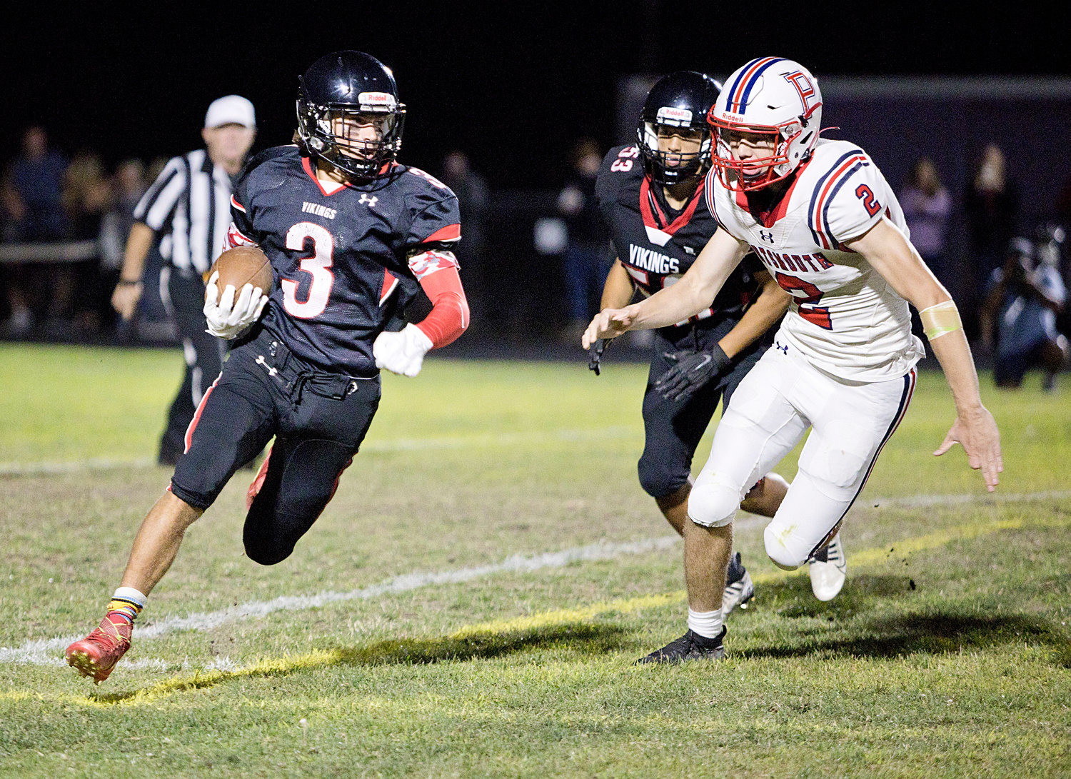 Tyler Hurd pursues a Rogers running back during the first half of Thursday's Injury Fund game in Tiverton.