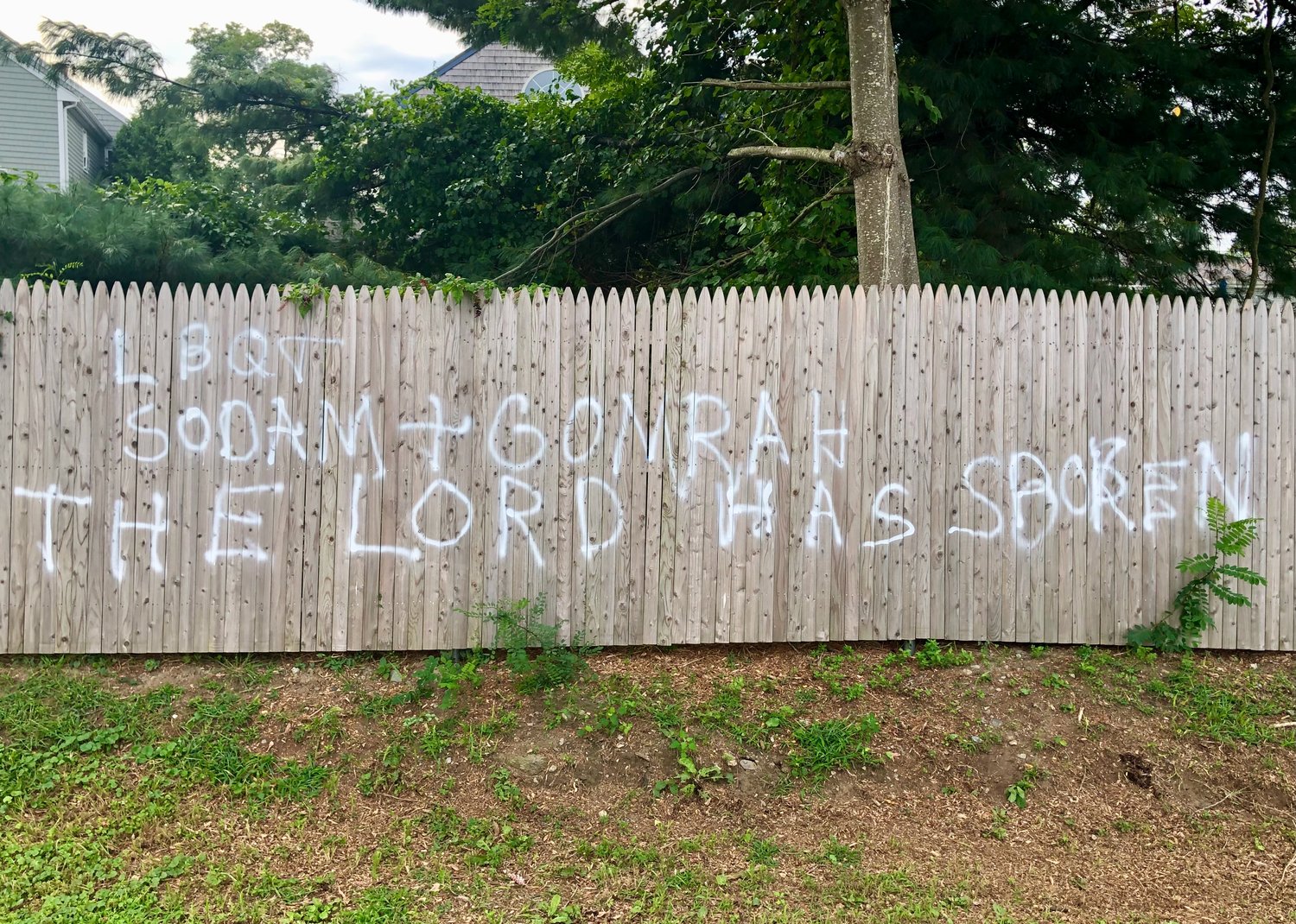An example of the graffiti that appeared on a fence outside the CFP Arts, Wellness, and Community Center on Sunday, just hours before the Portsmouth Democratic Town Committee’s annual fund-raiser there.