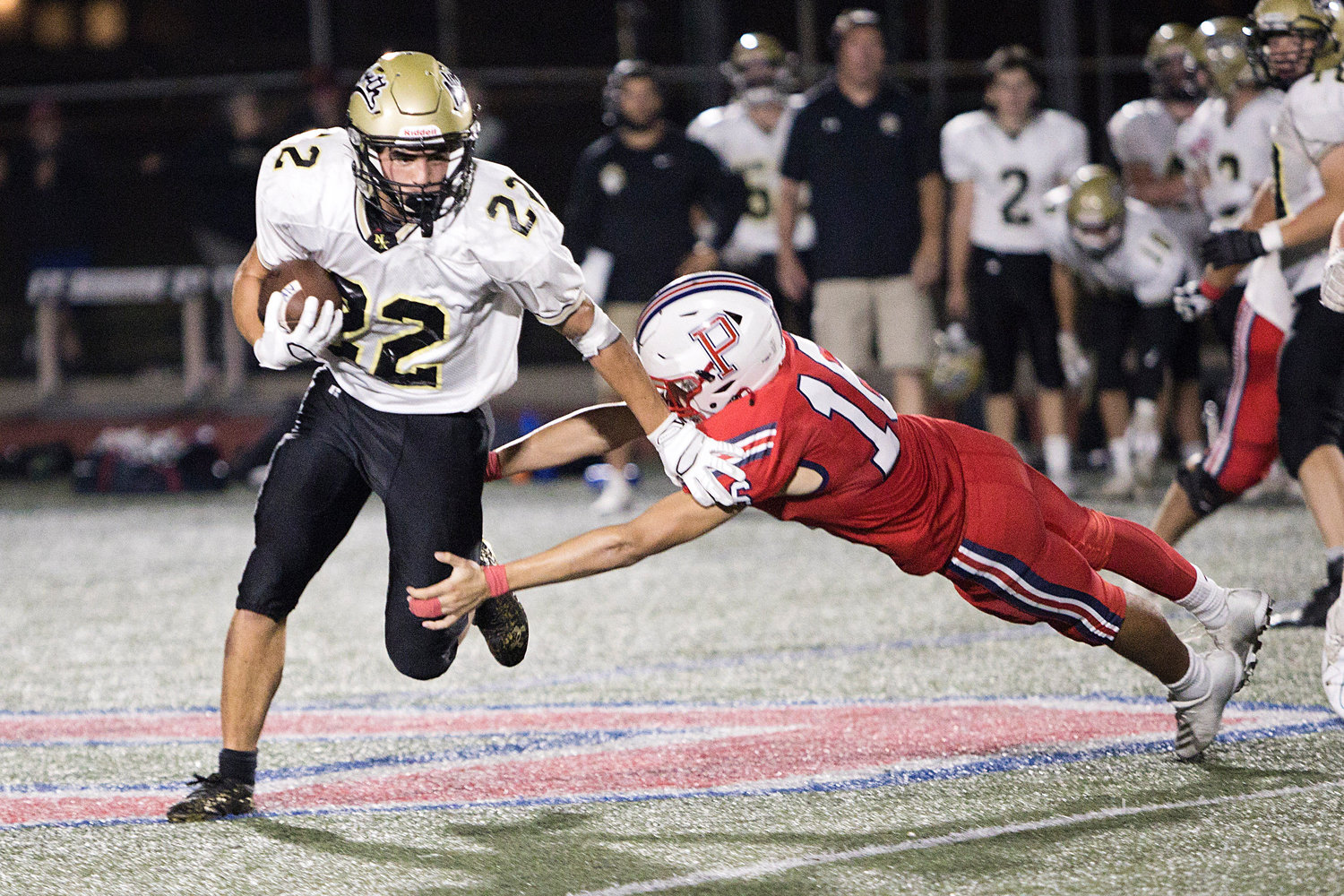 George Smith extends himself toward a North Kingstown runningback.