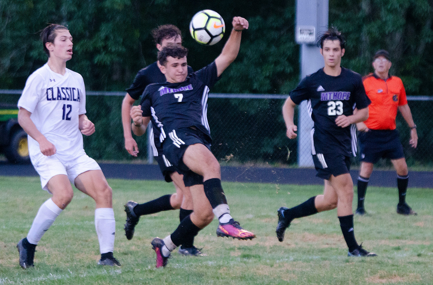 Senior midfielder Parker Camelo attempts to kick in a pass from a free kick late in the game. Jesse Wilson is at right.
Wilson scored the Huskies lone goal to tie the game in the second half.