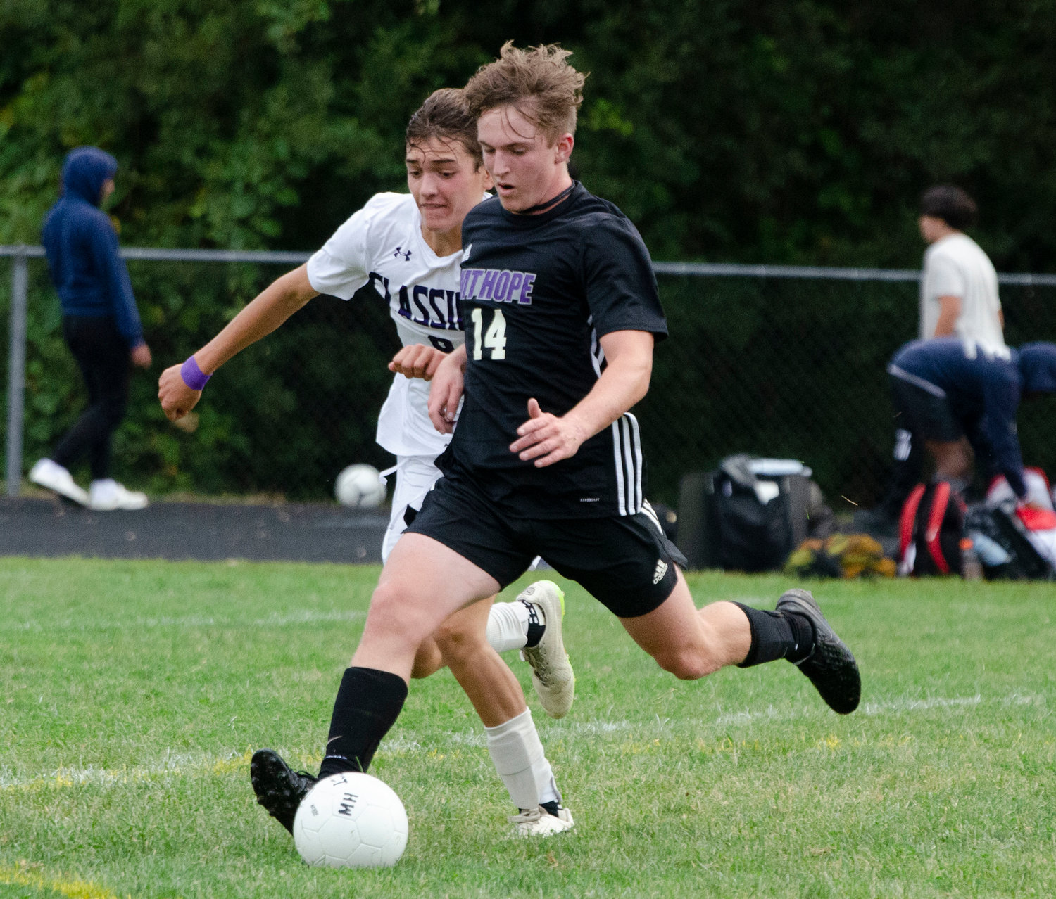 Senior defender Griffin Berardo clears the ball out of the Huskies defensive zone.
