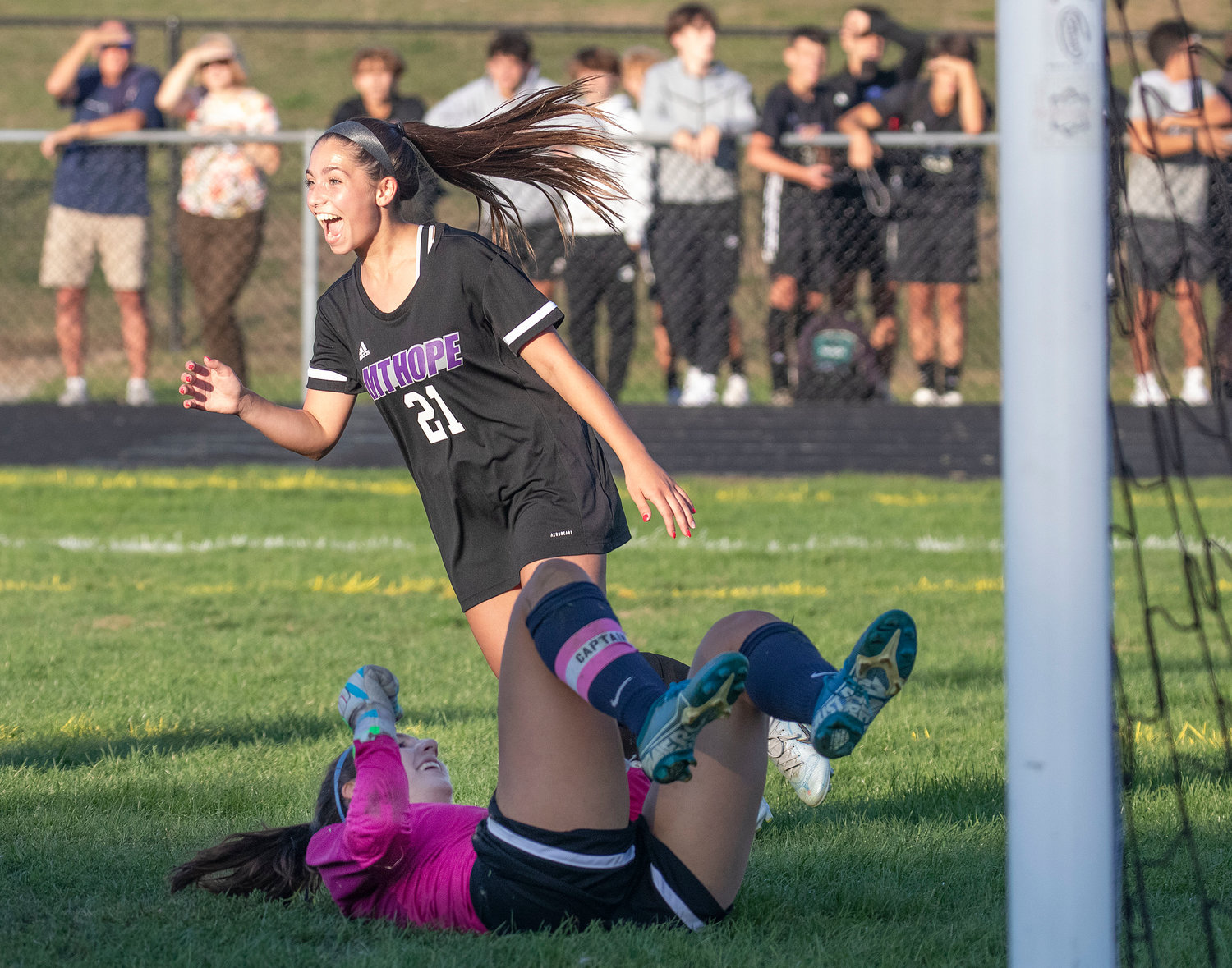 Lilliana Redman celebrates a goal by Thea Jackson in front of Helena DeFanti and the Barrington goal.