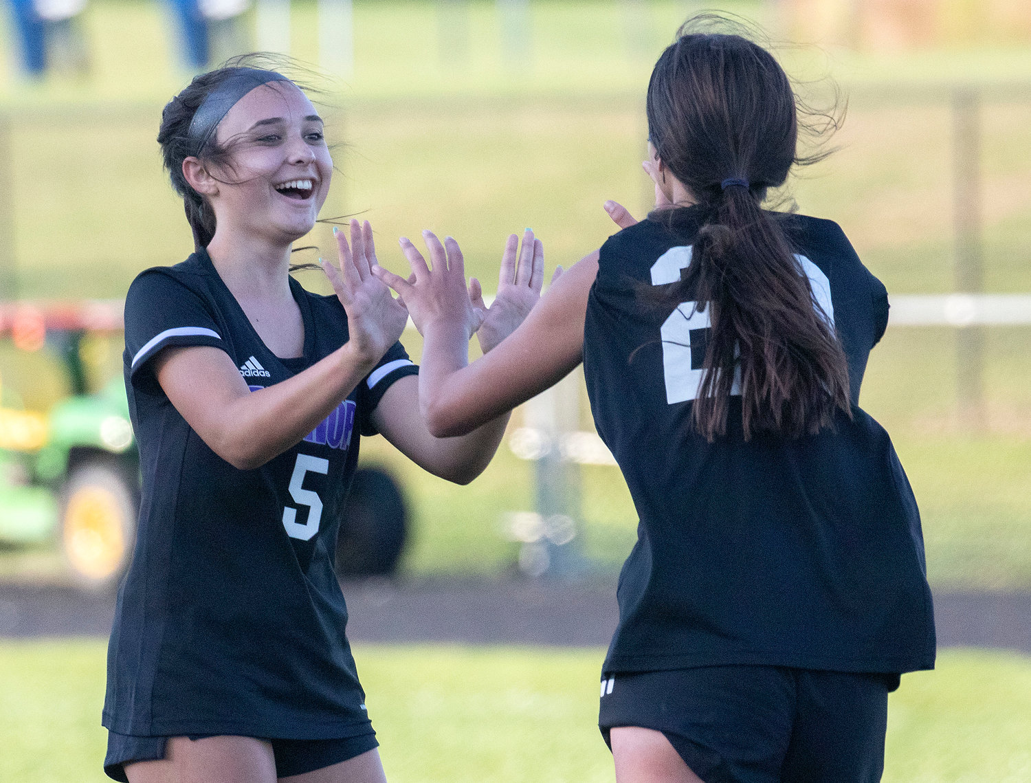 Freshman midfielder Madison Butterworth (left) celebrates with Thea Jackson after she scored in the first half.