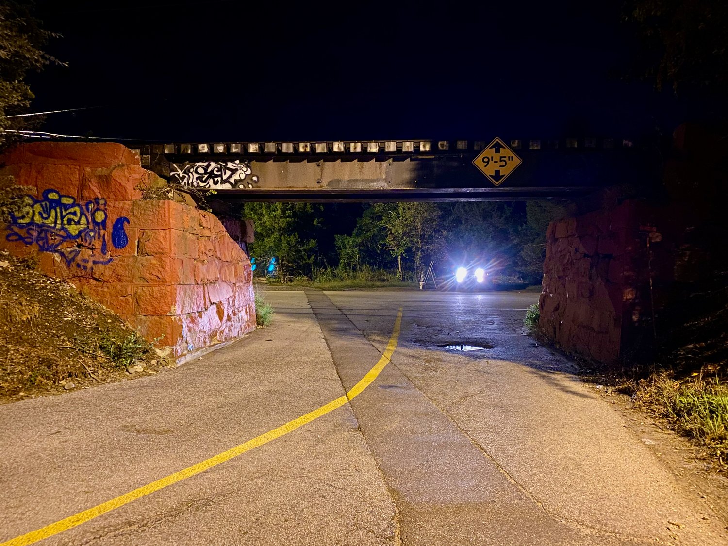 This photo, which Karyn Jimenez-Elliott snapped shortly after 5 a.m. Sunday, shows the graffiti on the railroad bridge at the entrance to Common Fence Point.