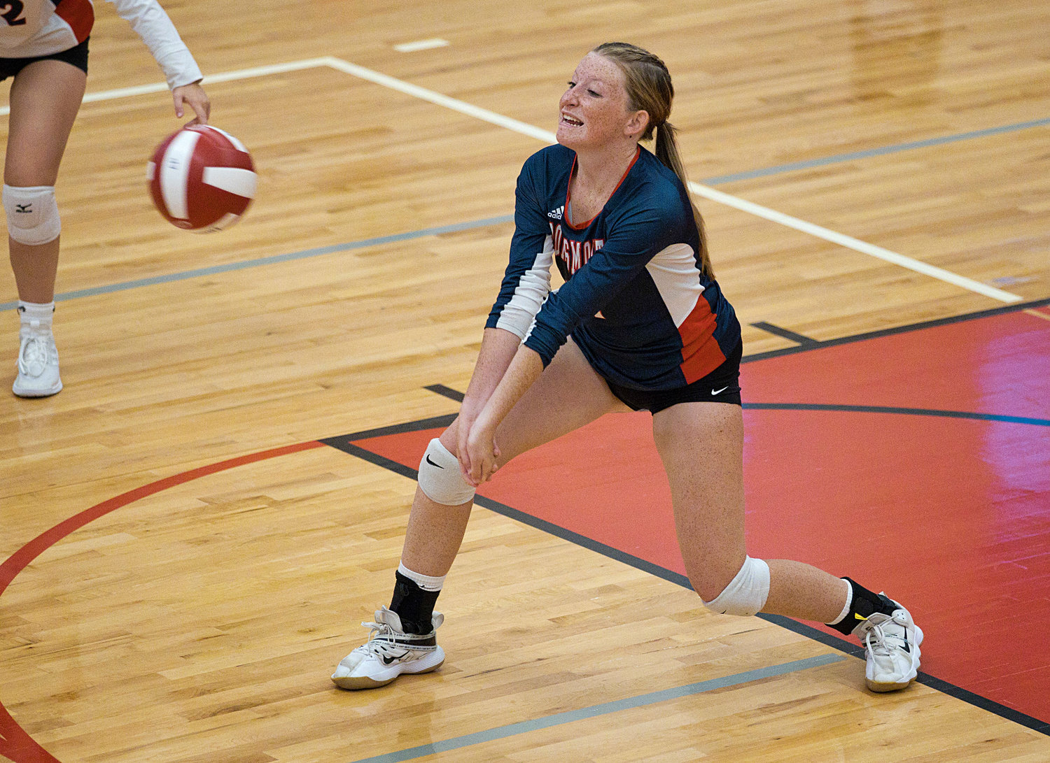Adele Palmer receives a serve during Friday's game.