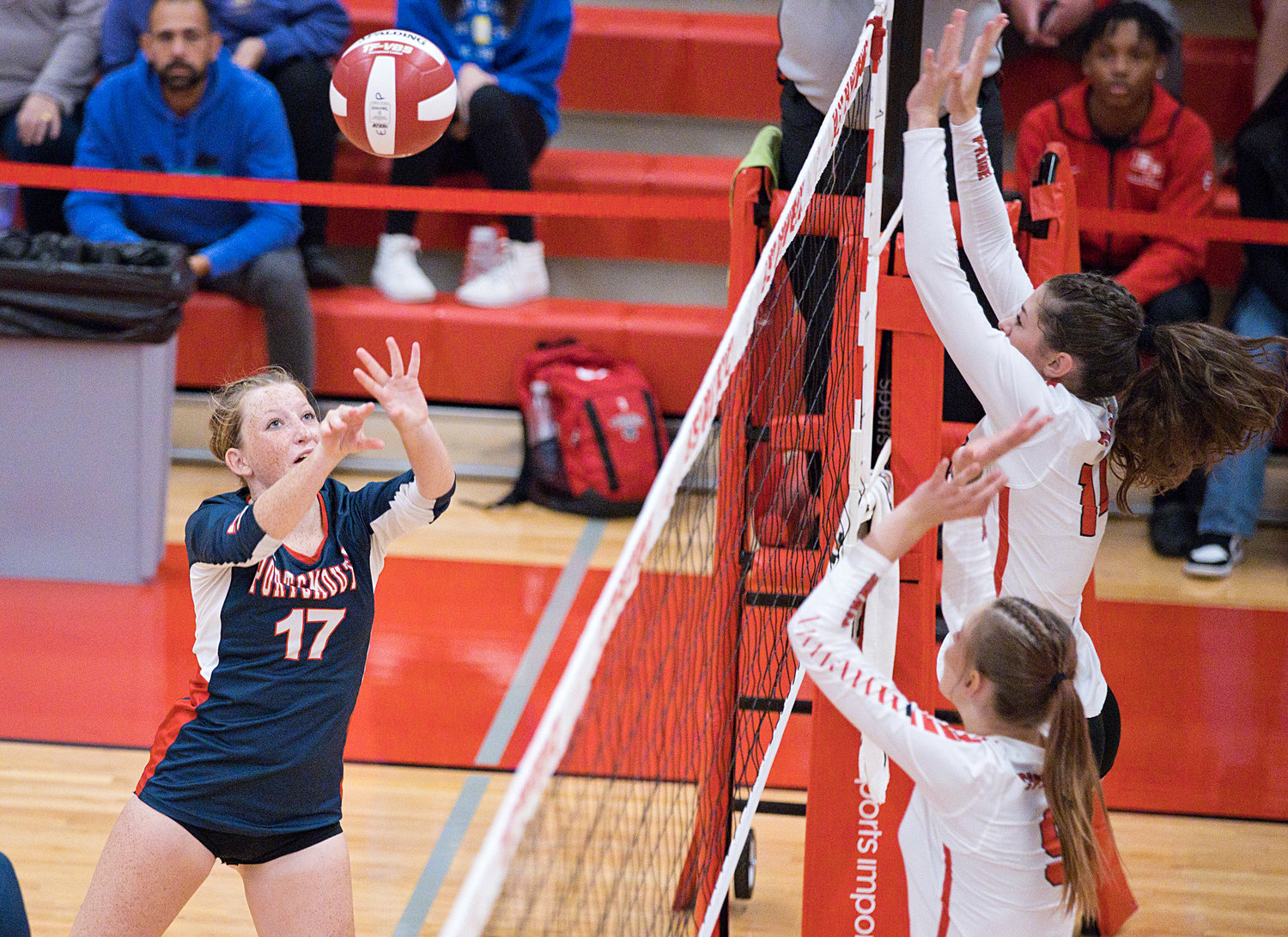 Avery Pelletier sets the ball over the net.