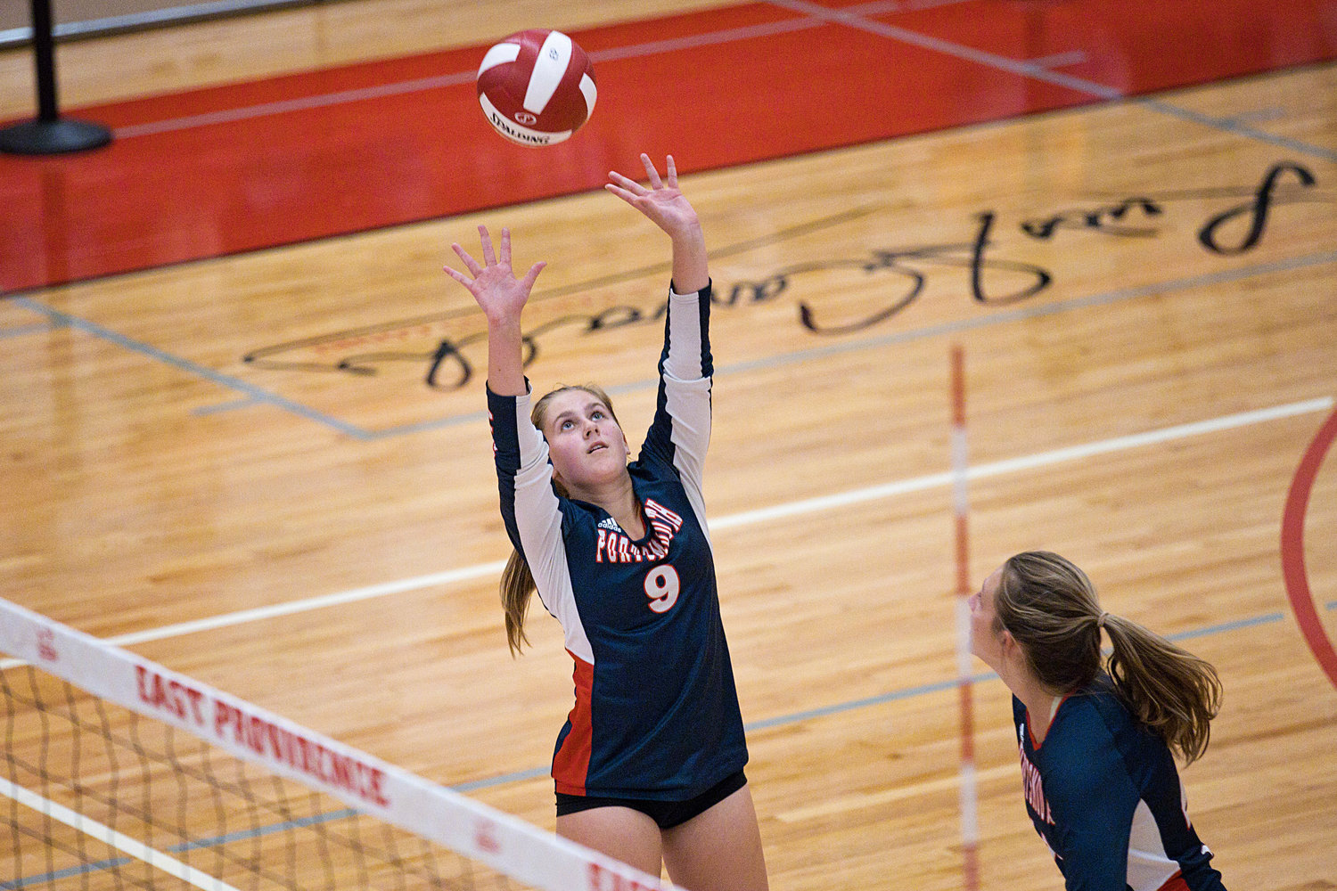Caitlin Mediate sets the ball to a teammate while rallying against the Townies.