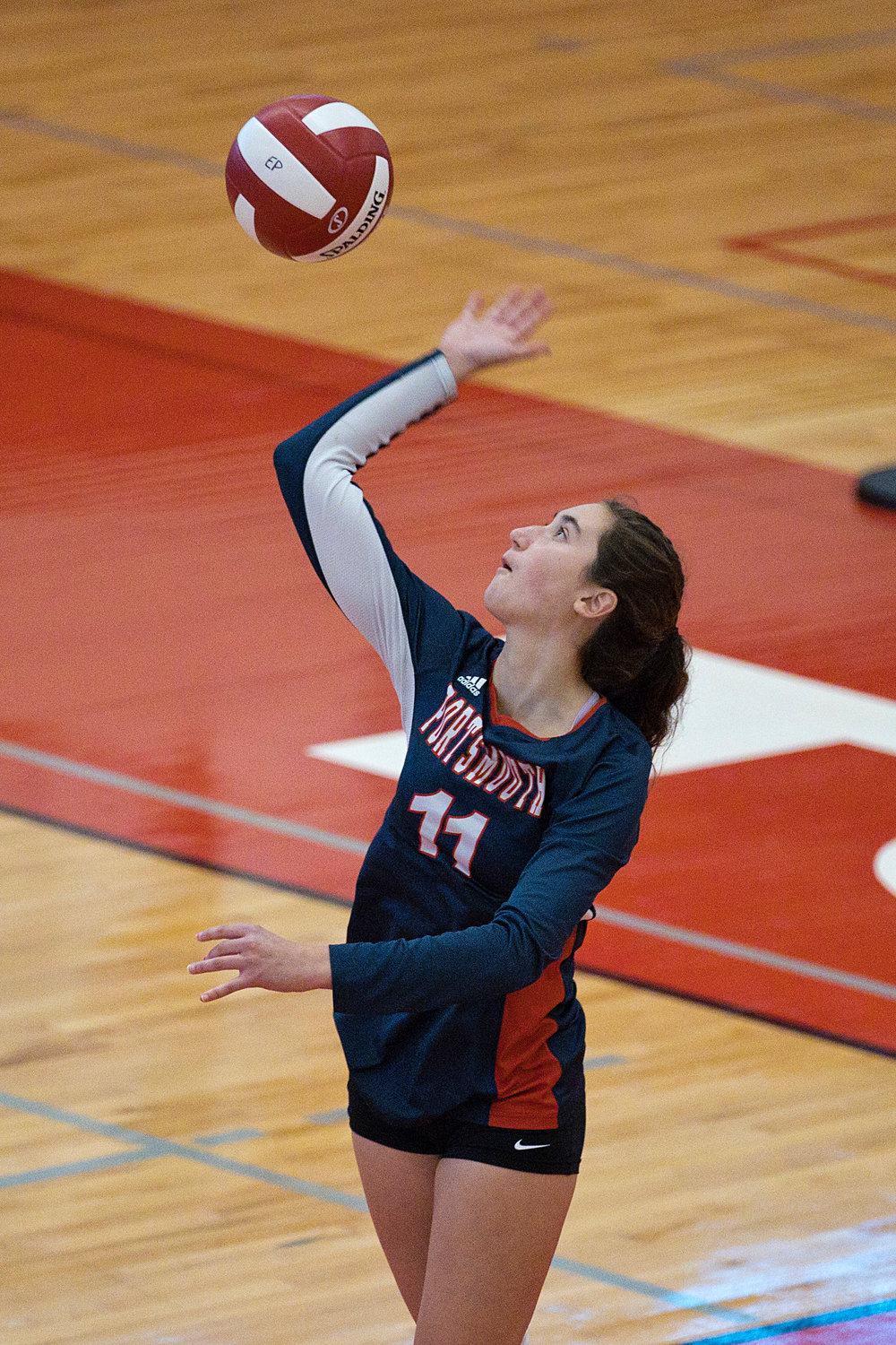 Hailey Labonte serves the ball to East Providence opponents.