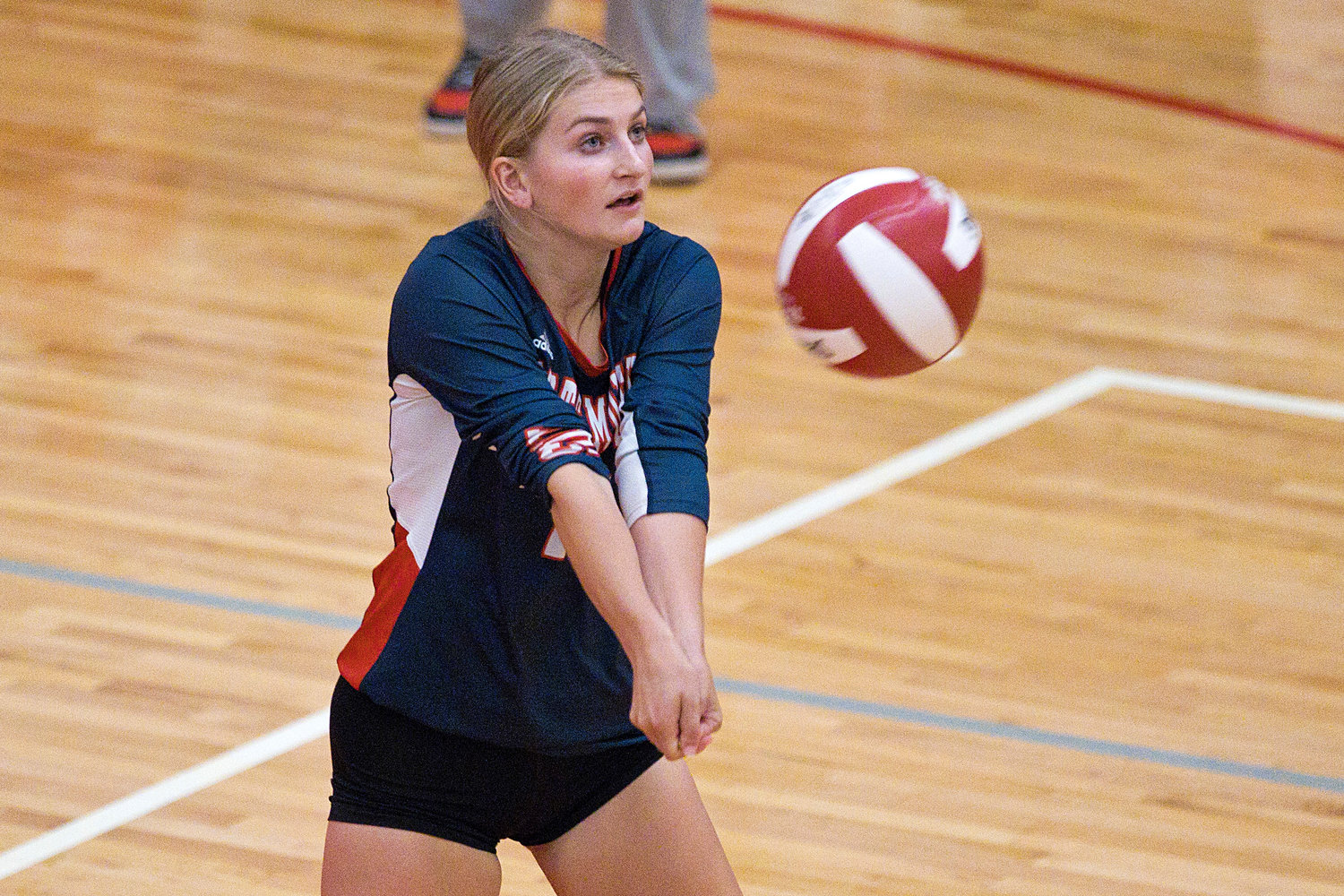 Victoria Thomas bumps the ball up for a teammate while competing against East Providence.