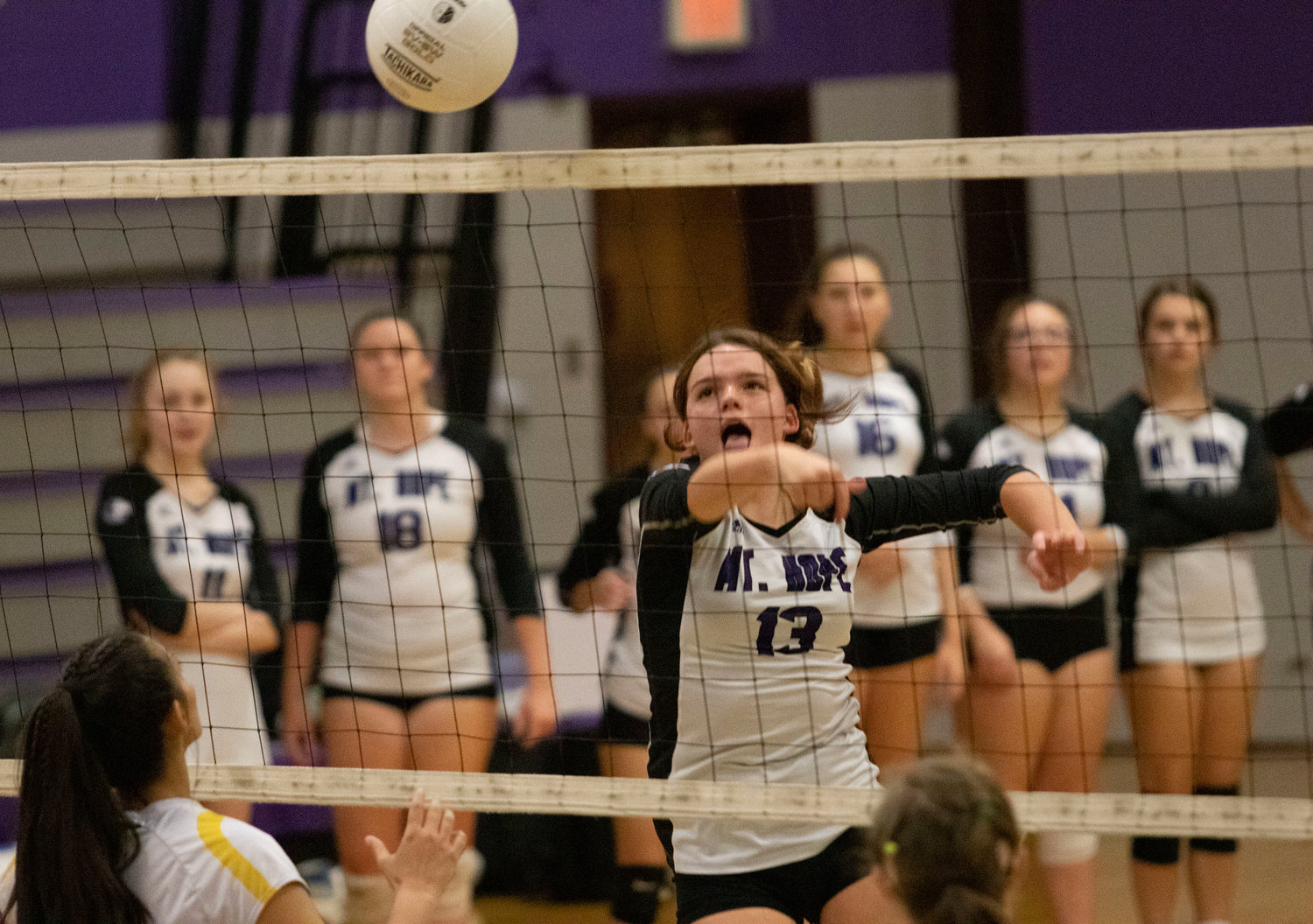 Junior co-captain Mia Shaw volleys the ball over the net during the Huskies home win over North Smithfield on Friday night.