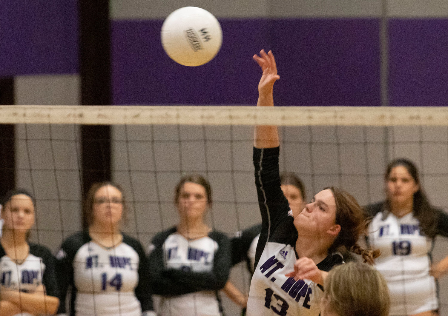 Mia Shaw spikes the ball over the net during an earlier game this season. The senior setter bashed five kills, dished out seventeen assists and made fourteen digs defensively.