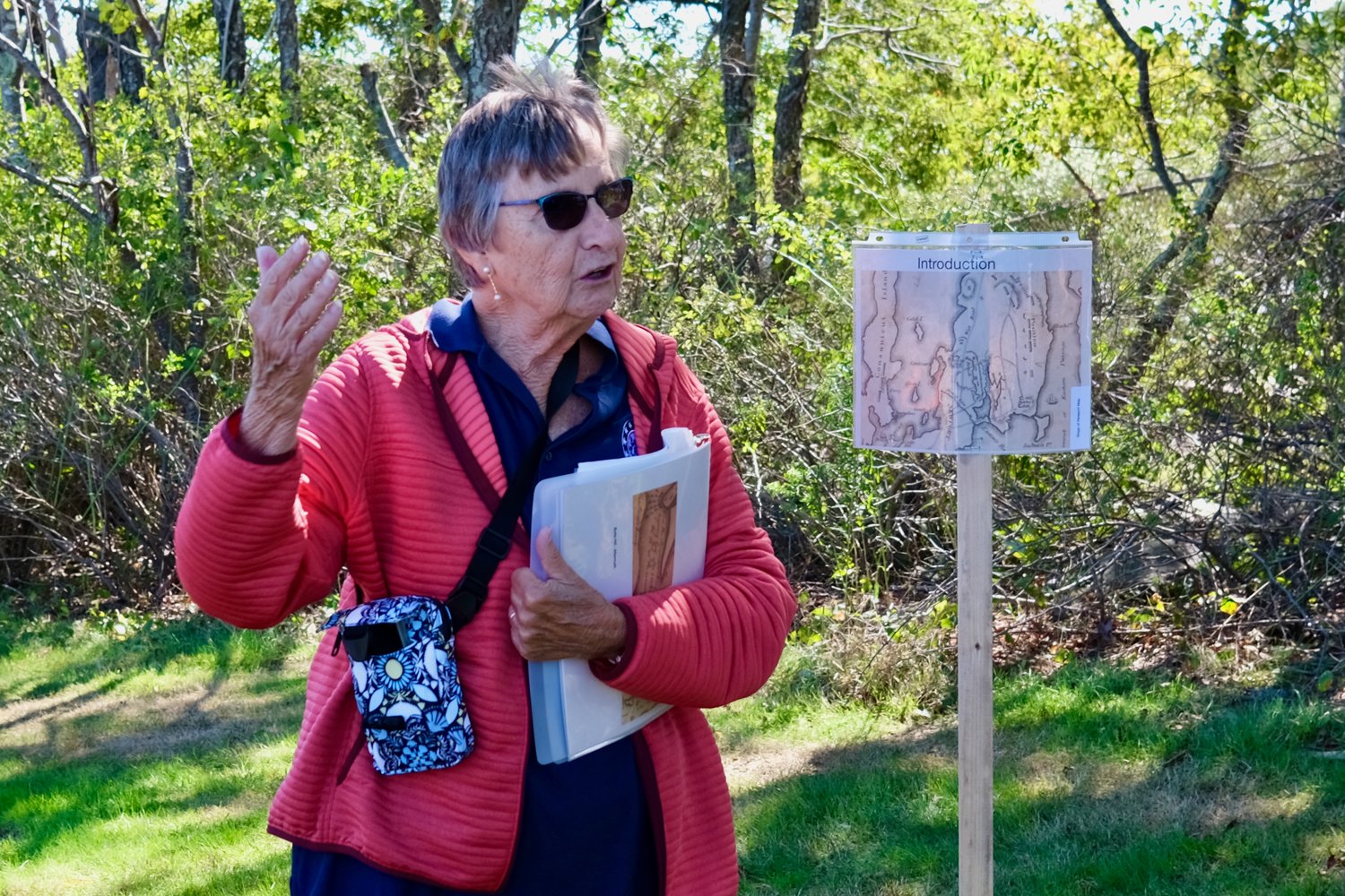 Gloria Schmidt, one of the main organizers and a guide on Saturday, makes introductory remarks to her group.