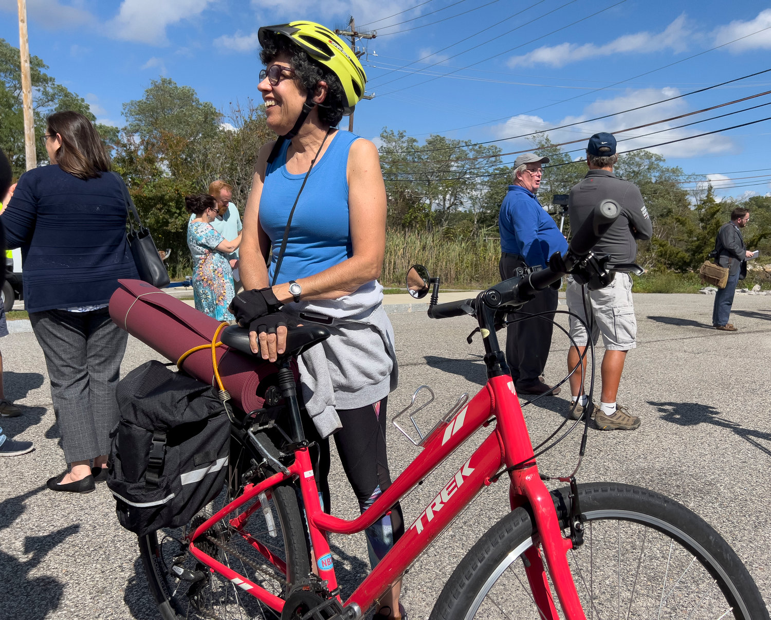 Barrington resident Laura Ward hears the news that the state will replace the East Bay Bike Path bridges during a special event at Police Cove Park on Monday.