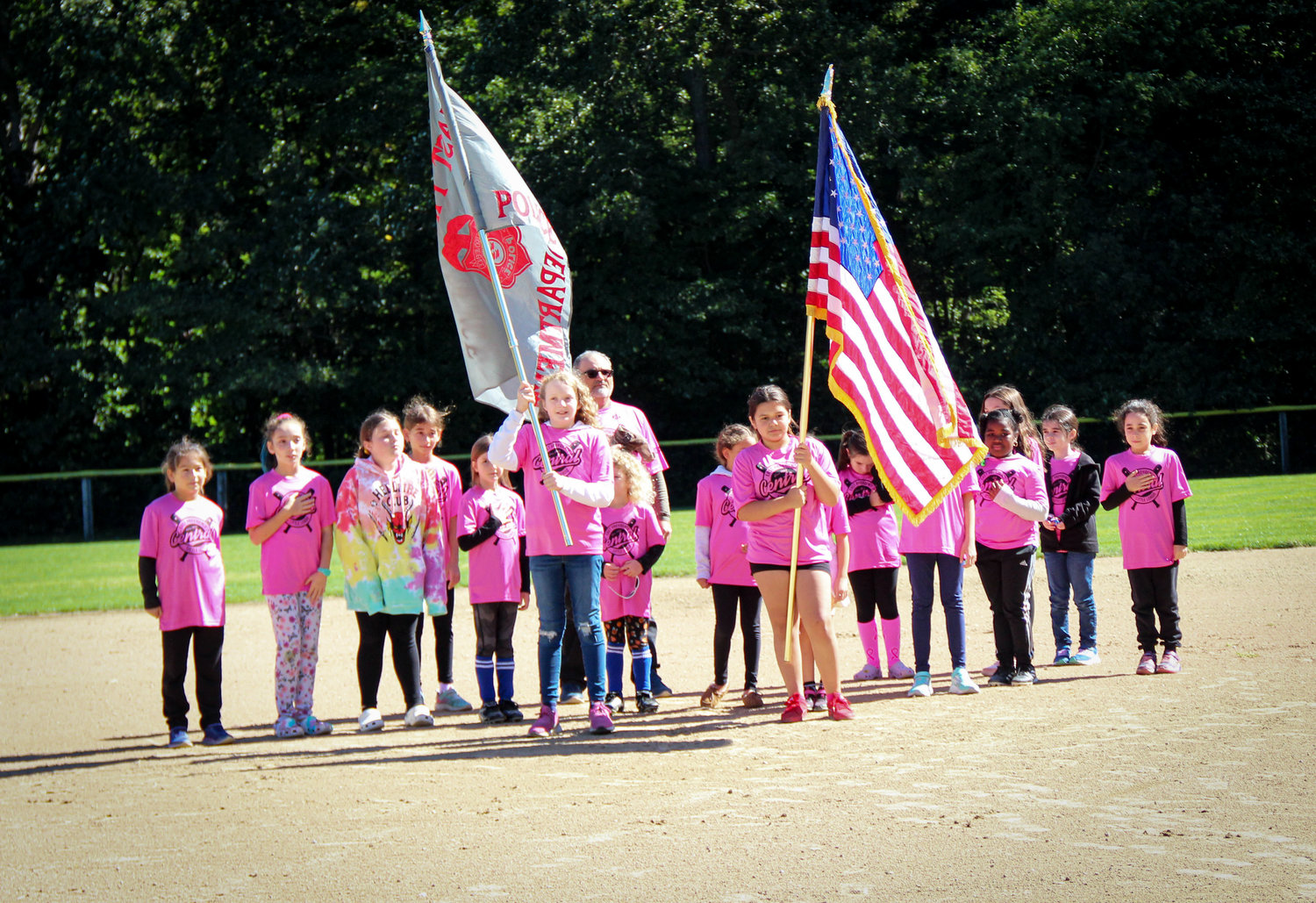 EPCLL players serve a flag bearers prior to the game.