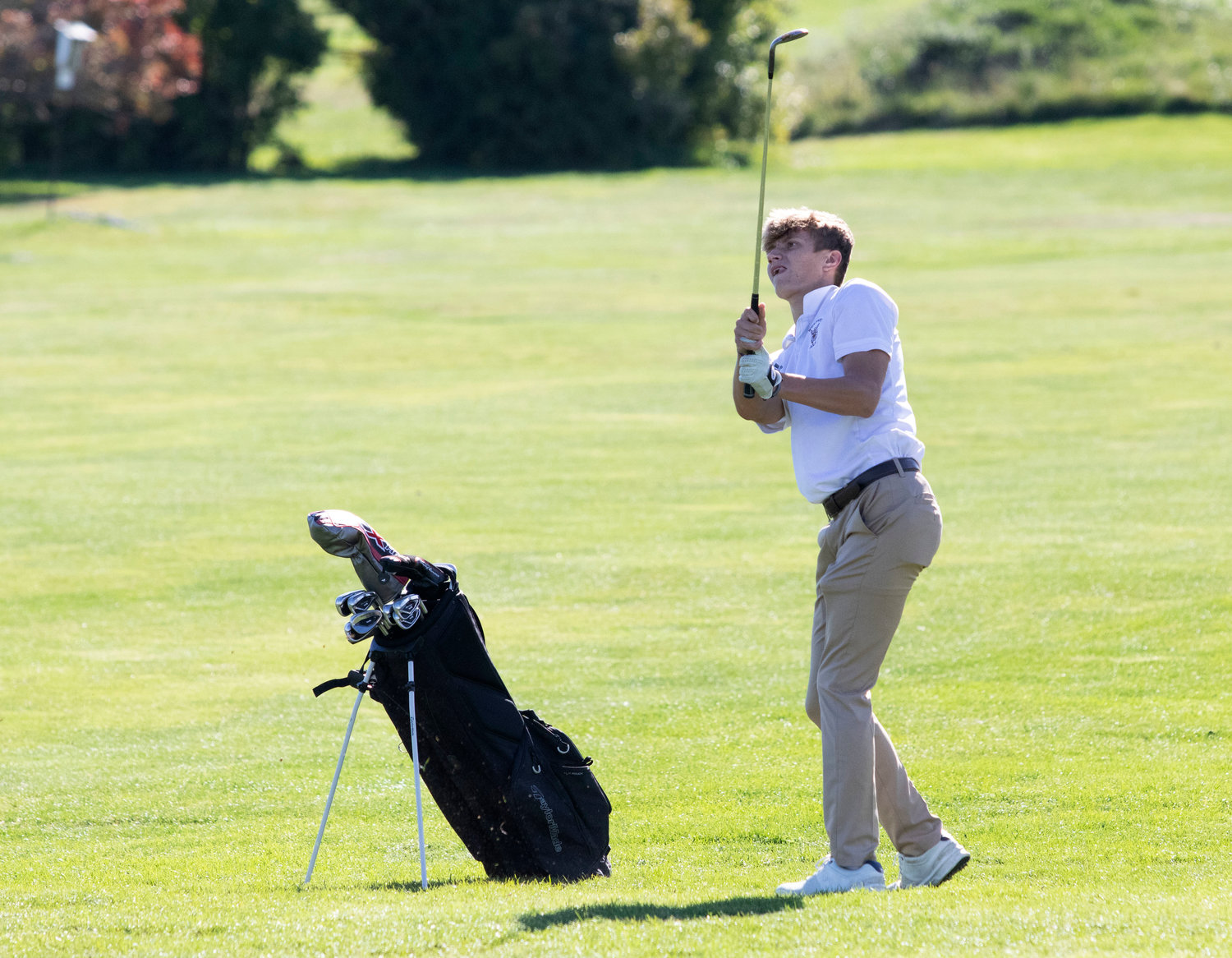 Avery Viveiros, Westport’s number one golfer, hits an approach shot onto the first green at Acoaxet.