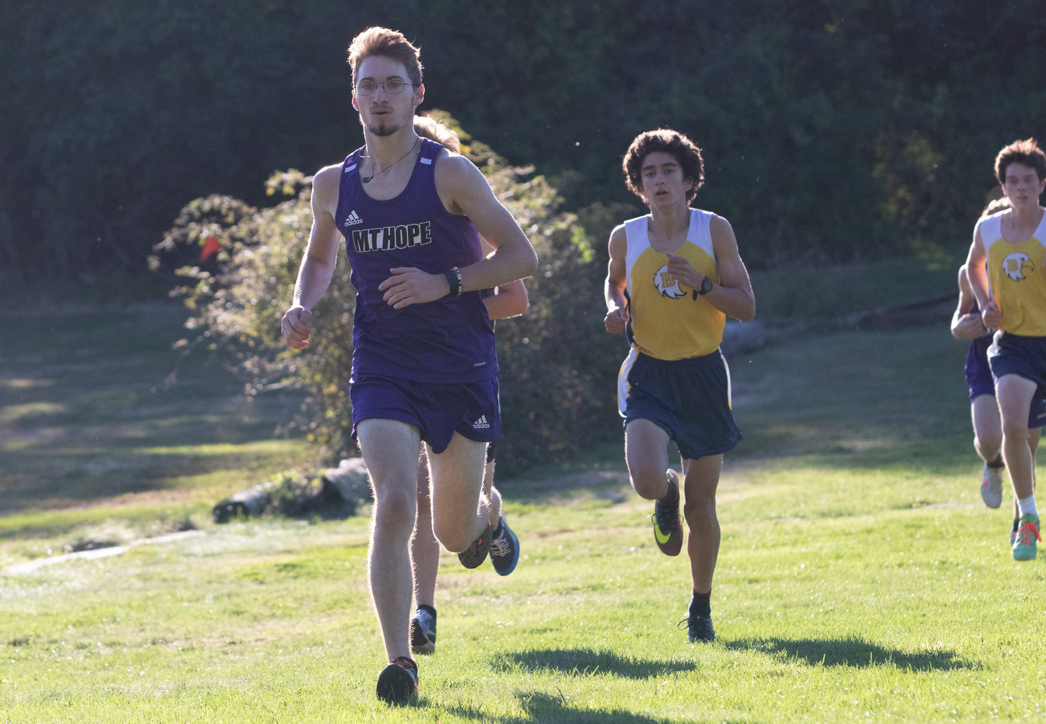 Junior Declan Reed (left) placed 16th with a time of 18:38.