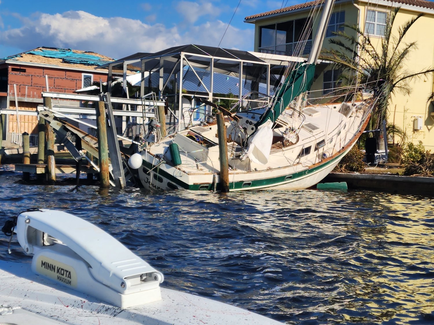 The canals surrounding Stephen Knapman's Matlacha neighborhood were full of scenes like this one, where yards remain adorned with high-and-dry vessels, many of which traveled from neighbors’ docks and boat lifts.