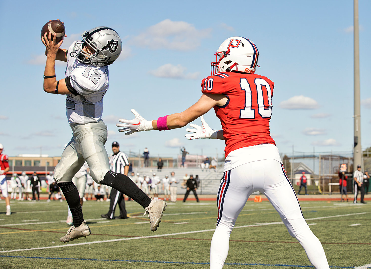A pass intended for Evan Tullson (right) gets intercepted by a Shea opponent during the first half of Saturday’s game.