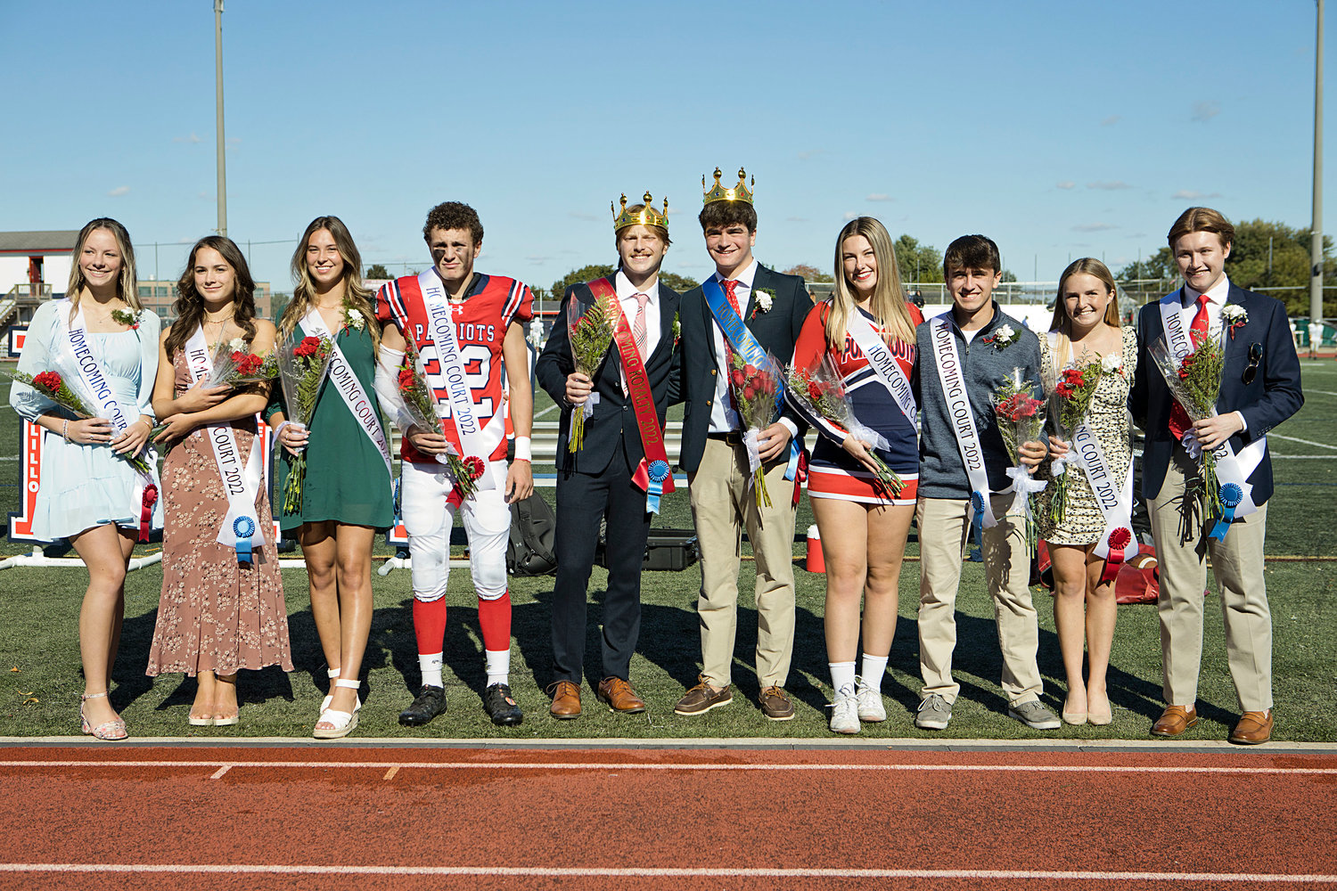 Lining up on the edge of the turf field are Homecoming court members (from left) Avery Snyder, Morgan Levreault, Ava Hackley, Dylan Brandariz, Nick Waycuilis (king), Luke Carlin (king), Phoebe Tavares, Andrew Alvanas, Elise Kirwin, and Jack Hollen.