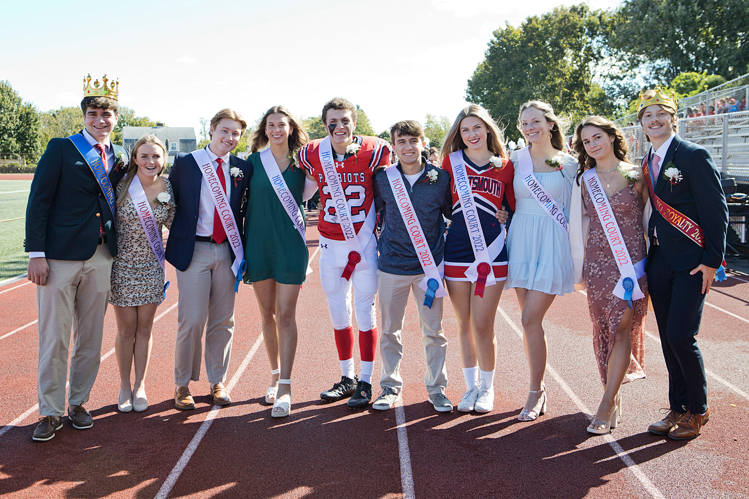 Posing for a photo on the track before the game are Homecoming Court members (from left) Luke Carlin, Elise Kirwin, Jack Hollen, Ava Hackley, Dylan Brandariz, Andrew Alvanas, Phoebe Tavares, Avery Snyder, Morgan Leverault, and Nick Waycuilis.