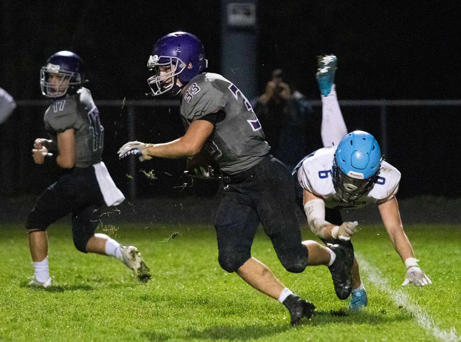 Huskies senior running back Brock Pacheco bursts up the middle for a big gain. Pacheco rushed for 117 yards and a touchdown and has 667 rushing yards on the season.