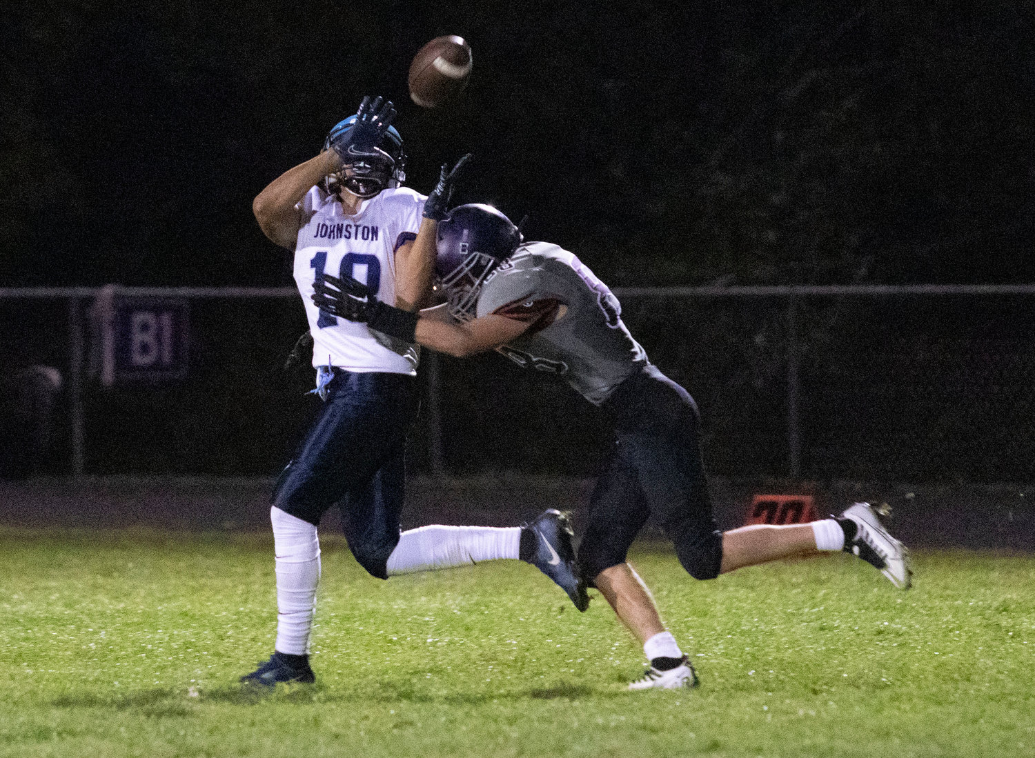 Jahaziel Rodriguez catches a bomb from Johnston quarterback Neari Vasquez with Huskies cornerback Evan Rodrigues on his tail. Rodrigues promptly tackled him at the 15 yard line.