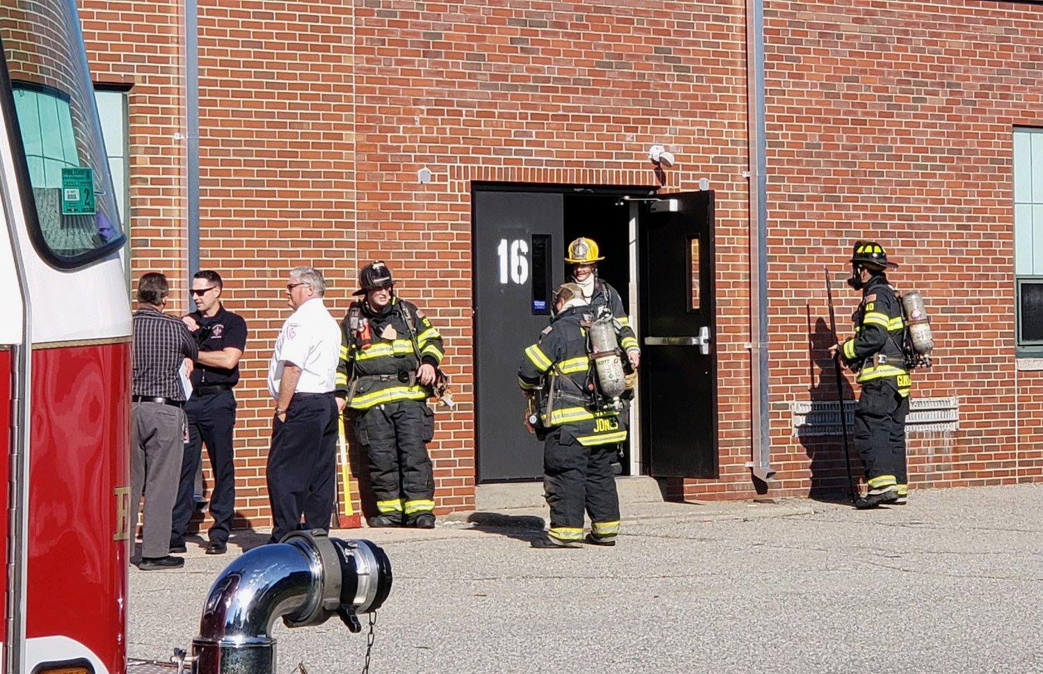Portsmouth firefighters outside the high school cafeteria Wednesday morning, Oct. 12, after receiving a report of a gas odor inside.