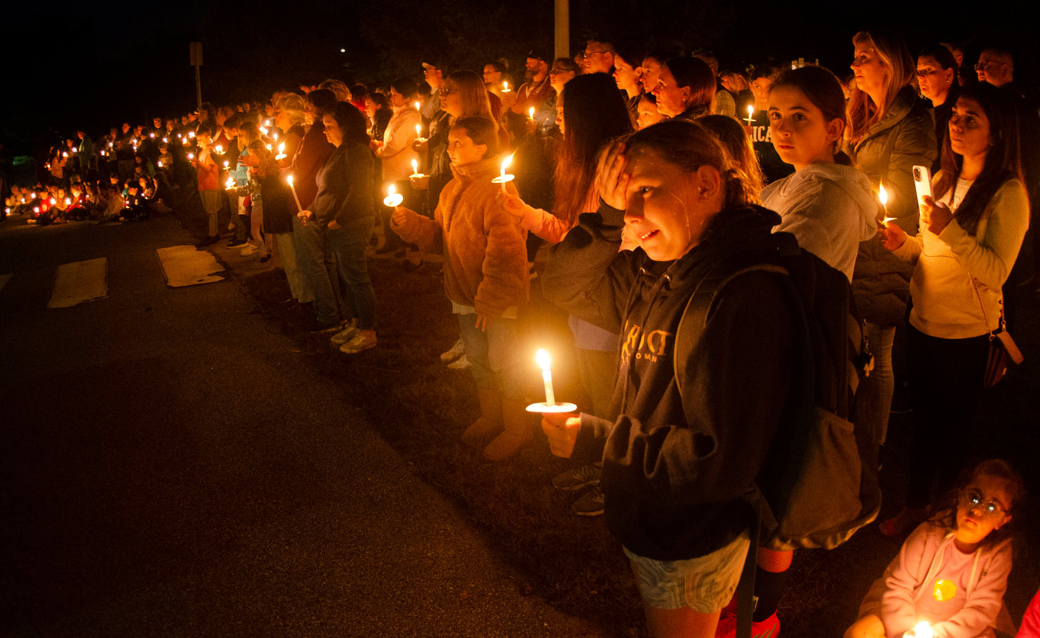 Students, parents, teachers, and hundreds of Barrington residents gathered for a candlelight vigil Wednesday night to celebrate the tiny Sowams Elementary School, which has seen two of its teachers die in the past three months.