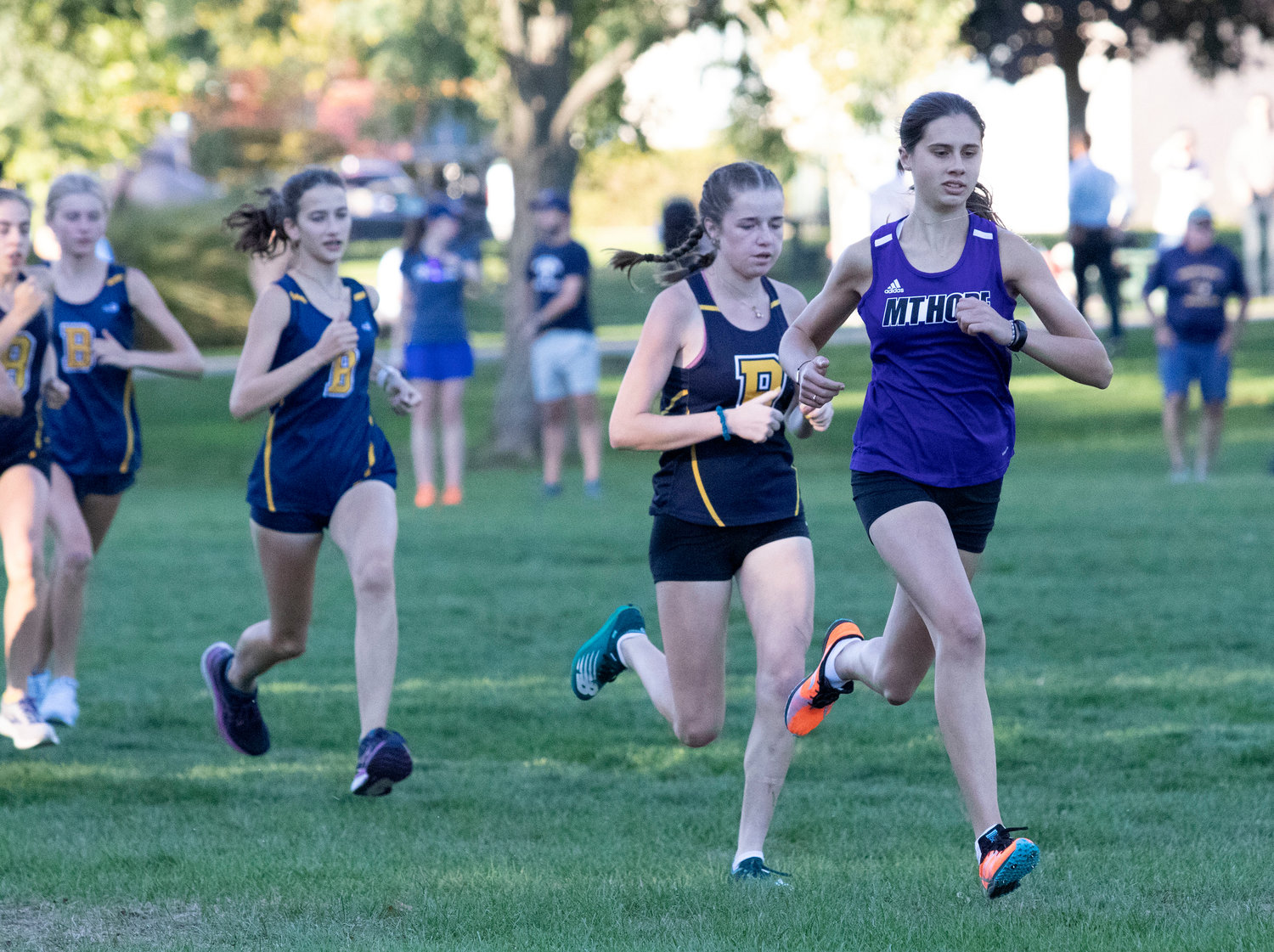 Mt. Hope's Jessica Deal (right) takes the lead during a home meet earlier in the season. Deal won the freshman state championship at Smithfield's Deerfield Park on Monday.