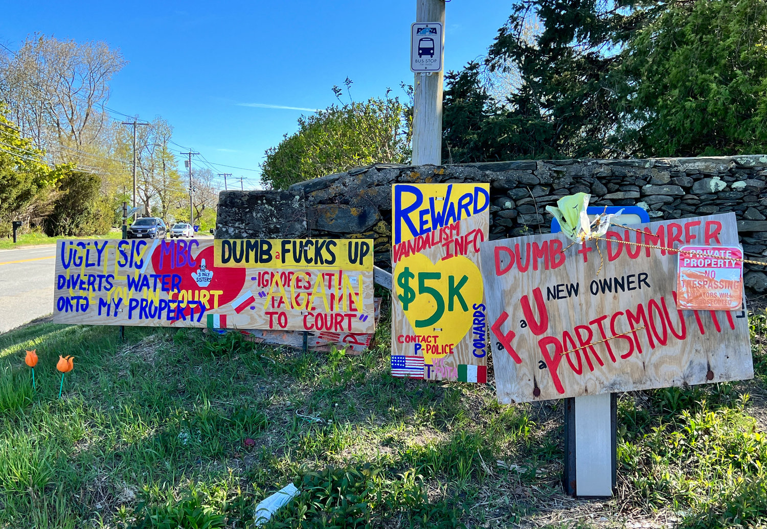 A sampling of some of Michael DiPaola’s signs displayed along East Main Road in the south end of Portsmouth.