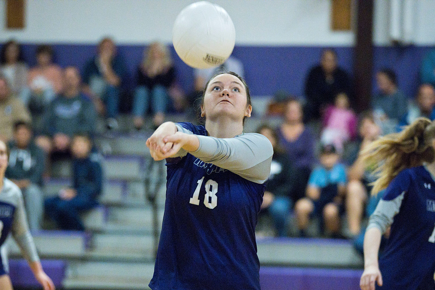 Mary Gerhard gets under the ball to keep it in play during the Preliminary game against Lincoln, Tuesday.