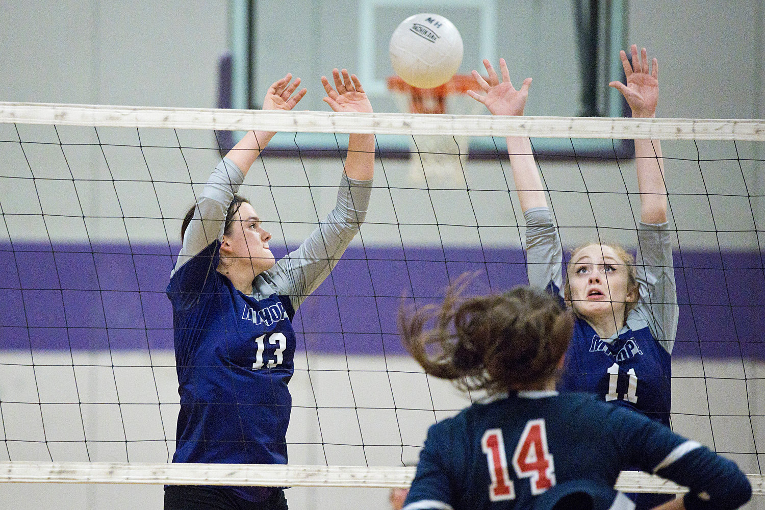 Mia Shaw and Jillian Brown defend the net while battling Lincoln in a preliminary game, Tuesday. 