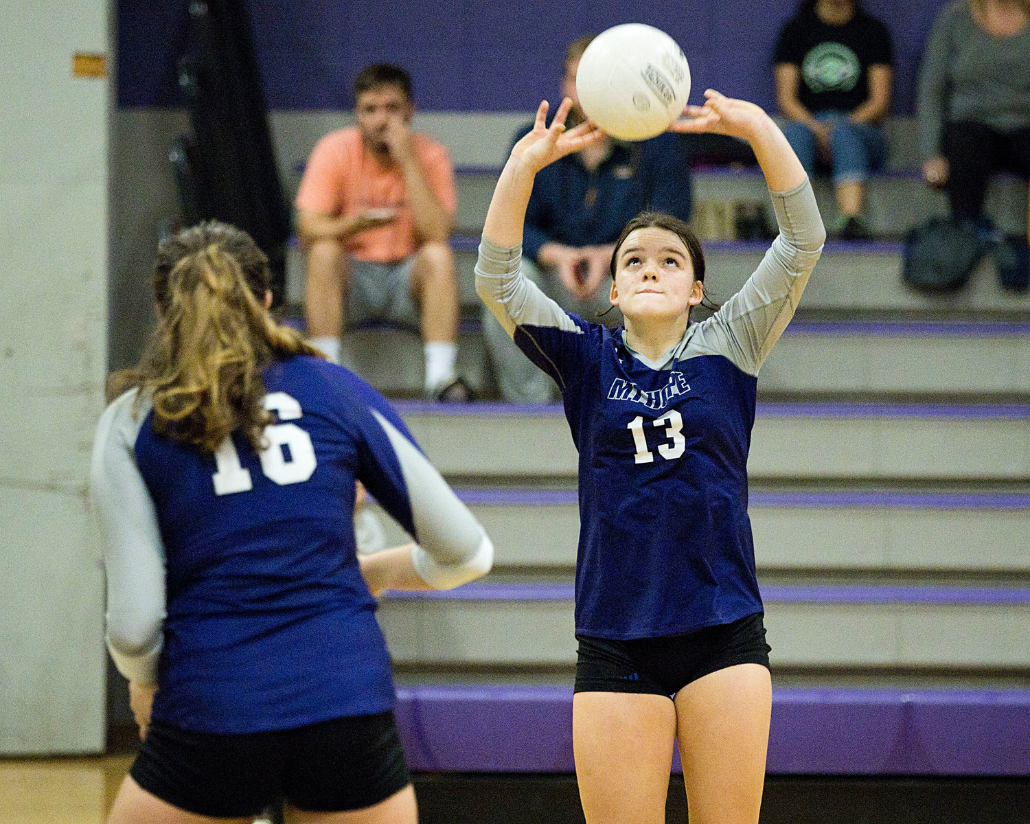 Mia Shaw sets the ball up for a teammate to spike. 