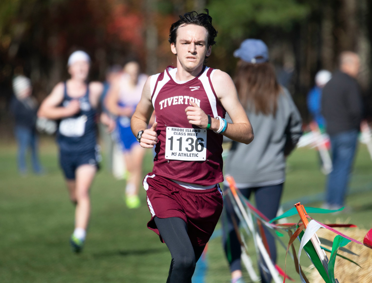 Senior Nick Mercer runs the covered bridge course at Ponaganset during the RI Class Championships on Saturday. He placed 34th and eclipsed his person best by seven seconds with a time of 18:30.3.