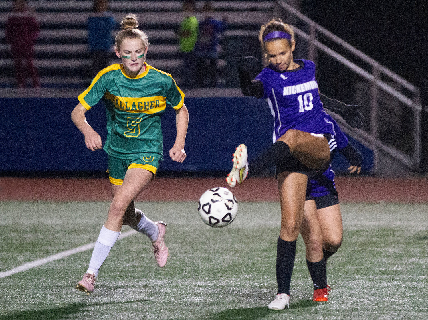 Thalia Adkins boots the ball upfield to thwart a Gallagher attack.