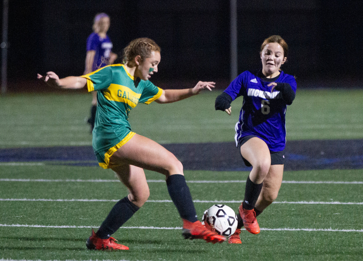 Angela Pirri dribbles the ball by a defender.