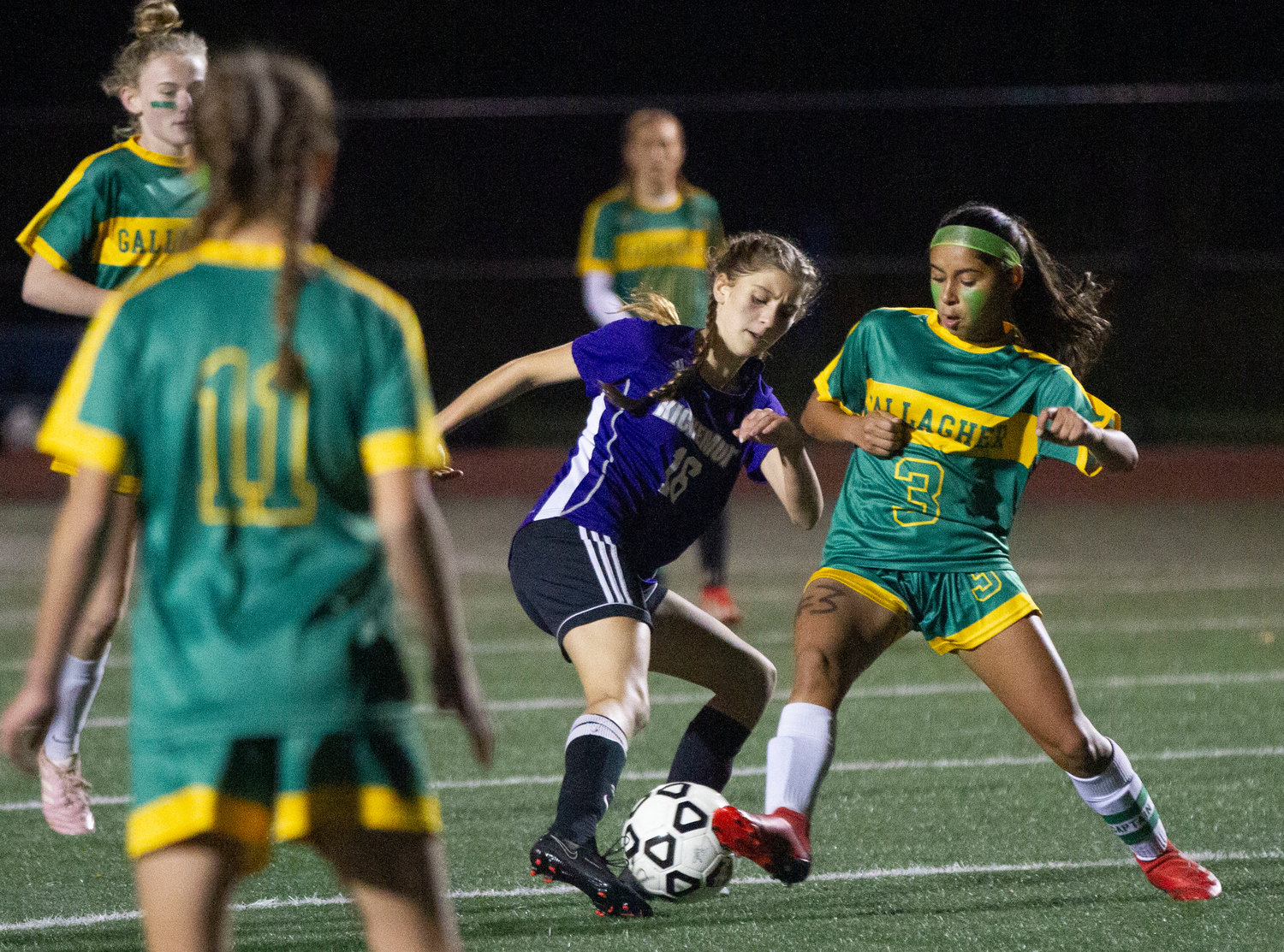 Kendra Ascoli fights for a loose ball at midfield.