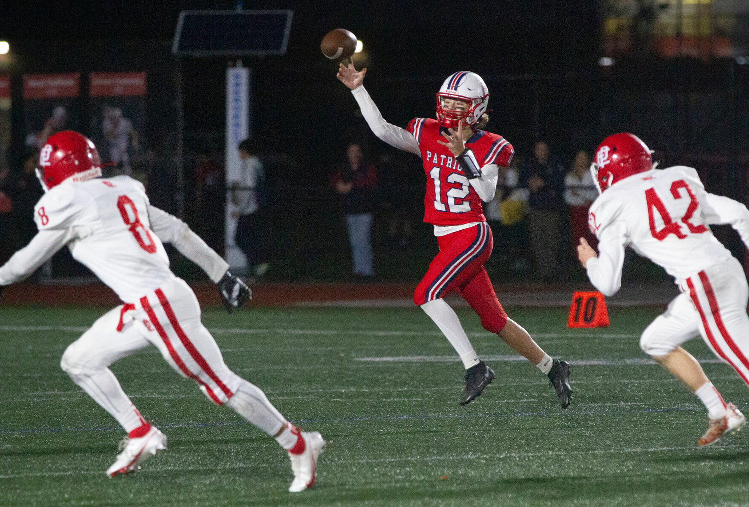 Sophomore quarterback Tom Hurd throws a pick-six to Townies linebacker Jahad Davis Pinto in the first half.