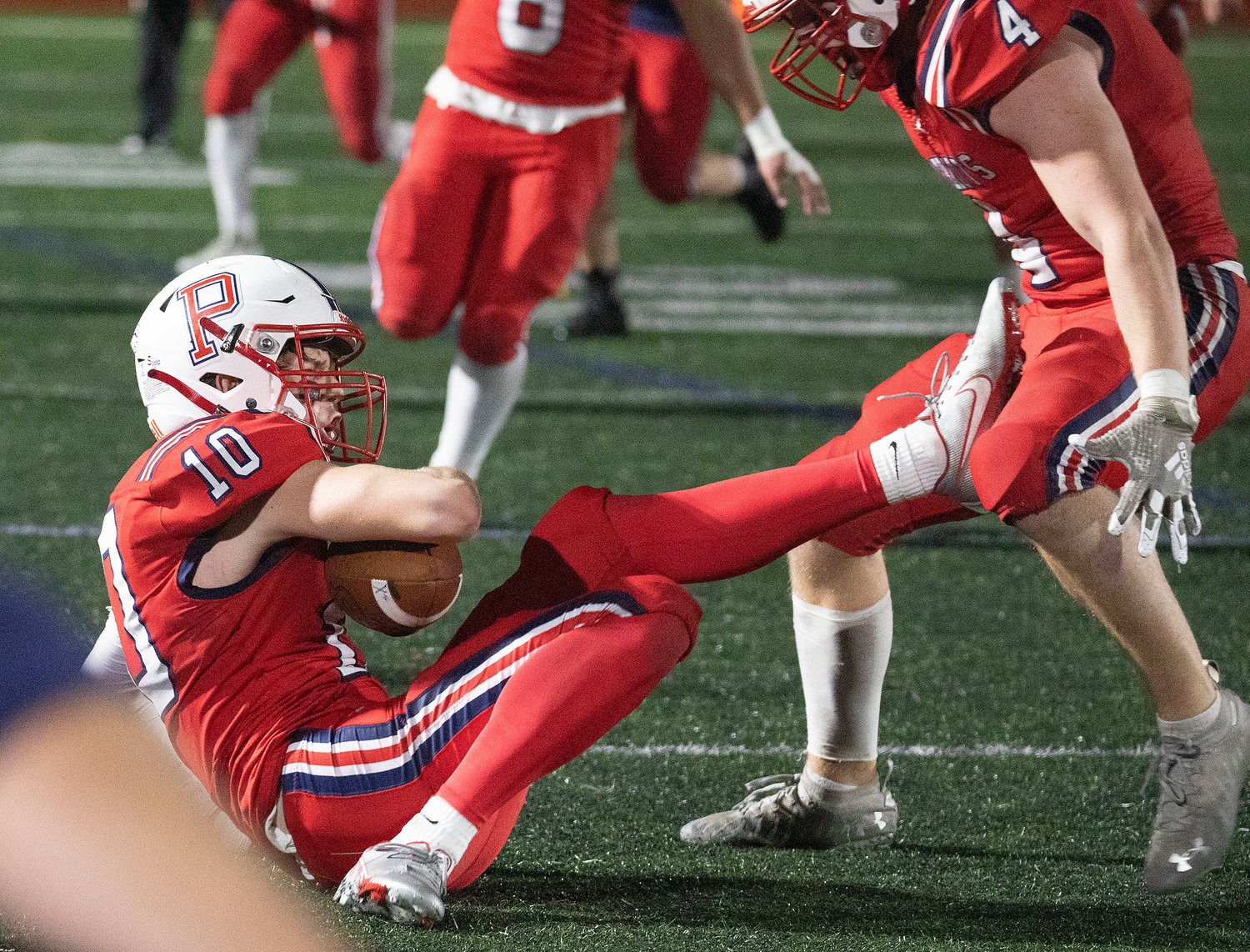 Cornerback Evan Tullson (10) intercepts Townies quarterback Maxwell Whiting in the second half with the Pats down 13-7.