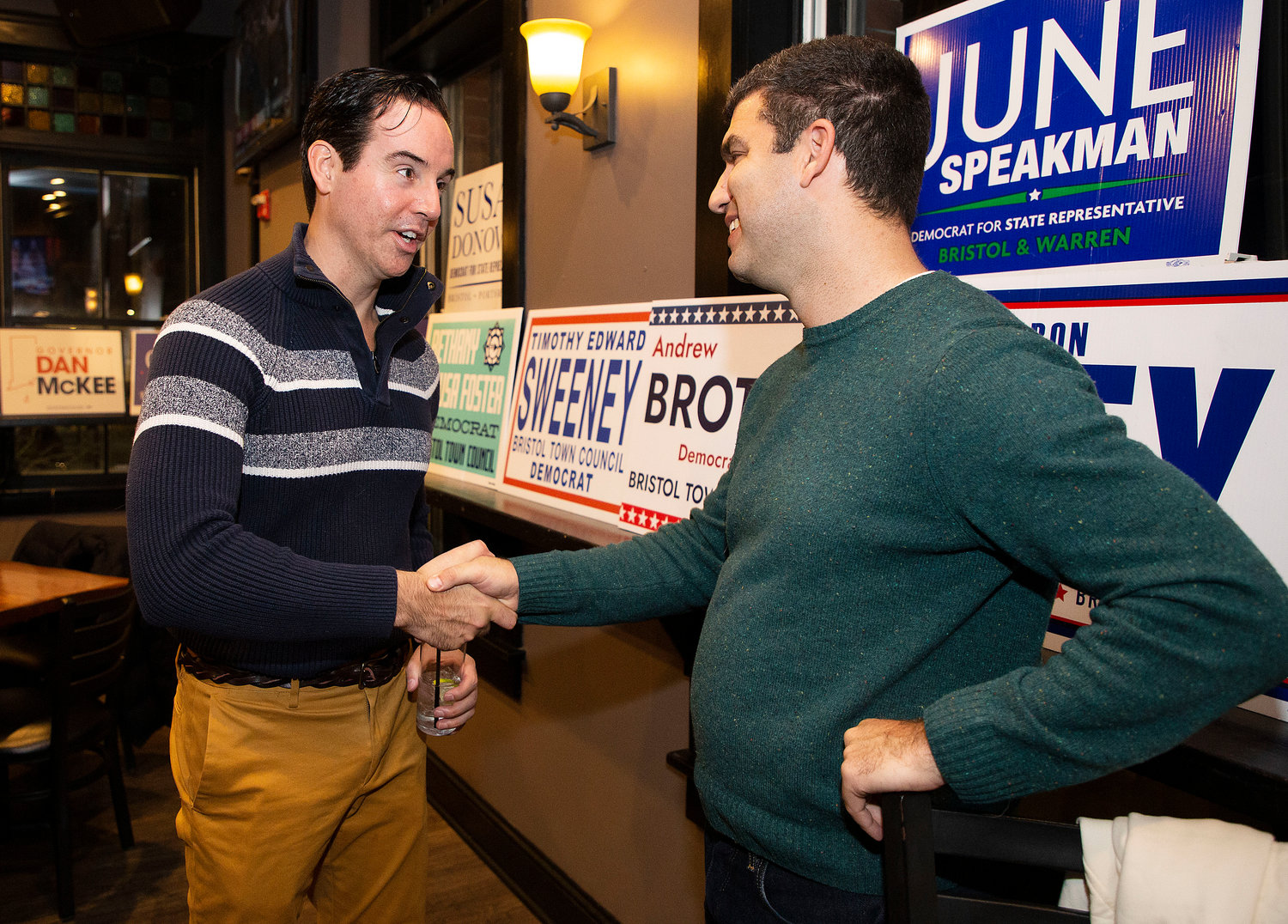 Tim Sweeney and fellow candidate Andrew Broten shake hands upon hearing election results.