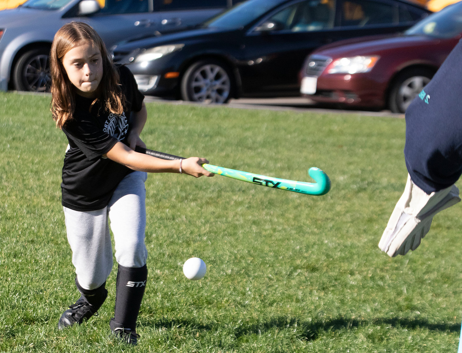 Sophia Babb, 11, plays field hockey with Start 'Em Young last week.