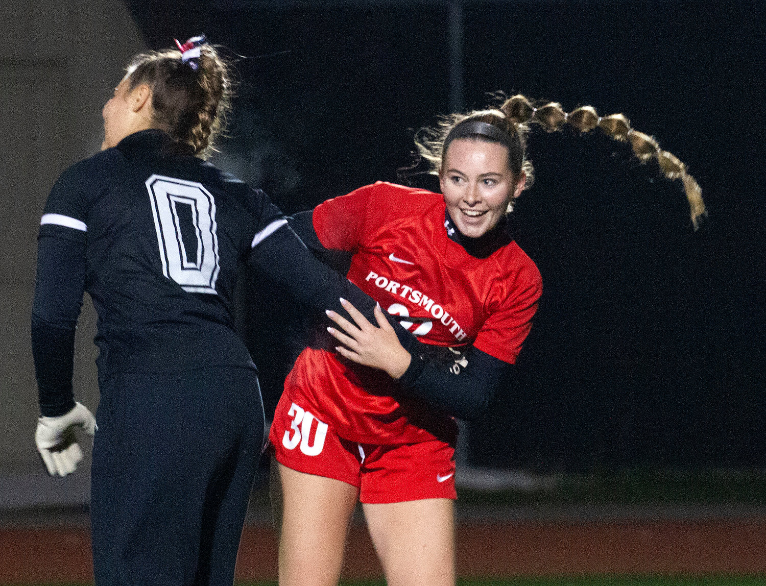 Lily Ferreira celebrates with goalkeeper Emily Maiato after the semifinals win over Ponaganset Wednesday night.