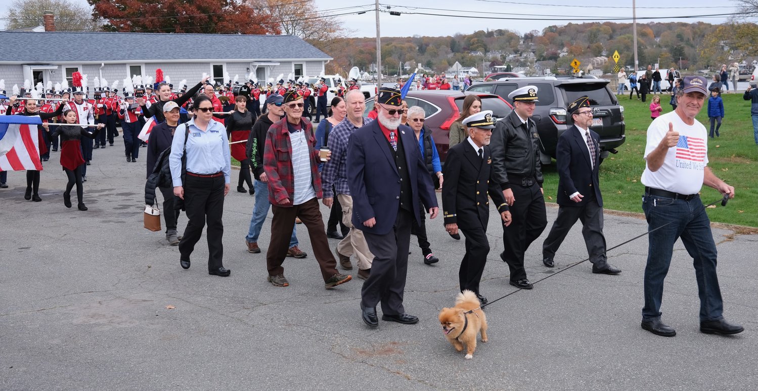 A parade from Stone Bridge leading to Thrive Coffee House was led by veterans, followed by the PHS Marching Band.