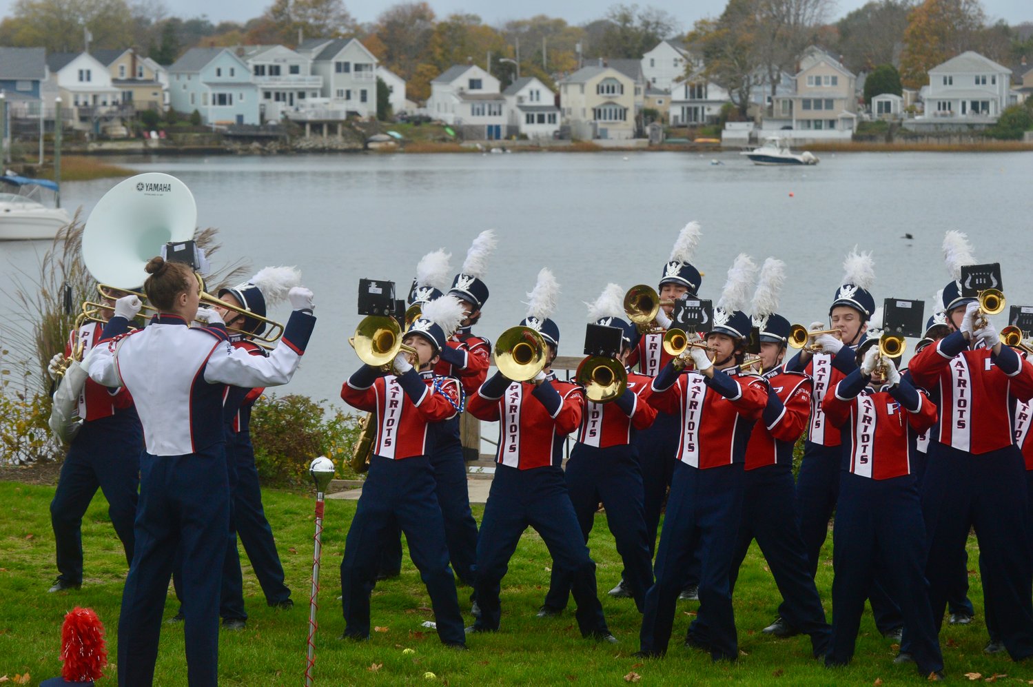 Band members perform for veterans on the Thrive Coffee House lawn overlooking Blue Bill Cove.