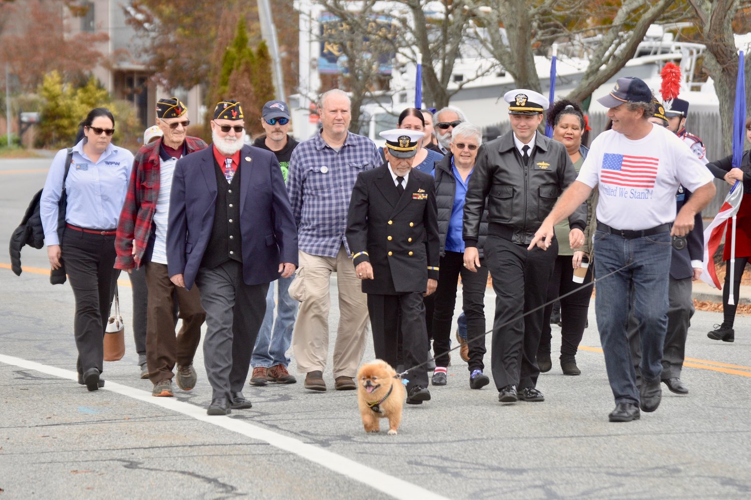 A parade Friday from Stone Bridge leading to Thrive Coffee House was led by veterans, followed by the PHS Marching Band.