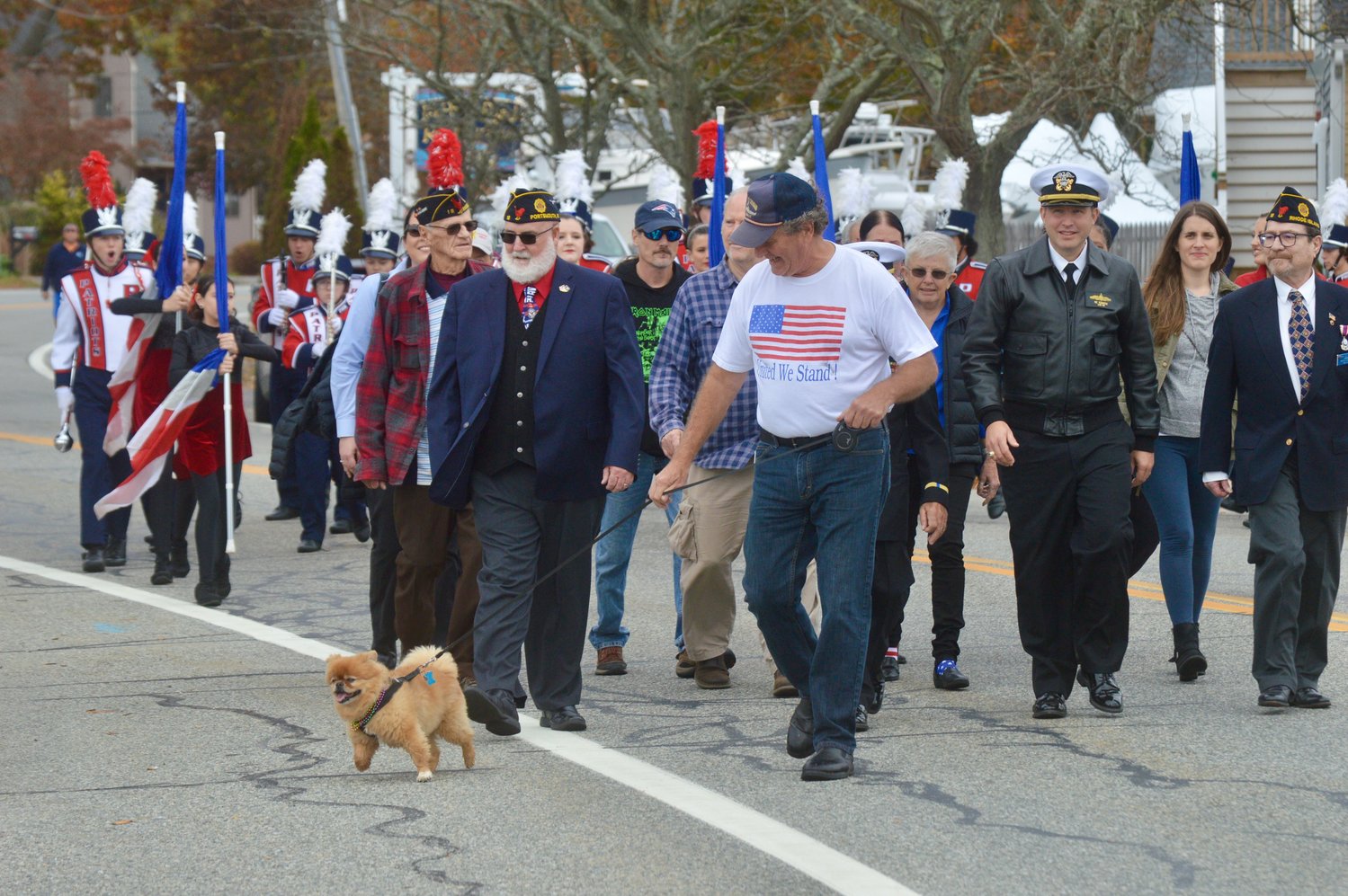 A parade from Stone Bridge leading to Thrive Coffee House was led by veterans, followed by the PHS Marching Band.